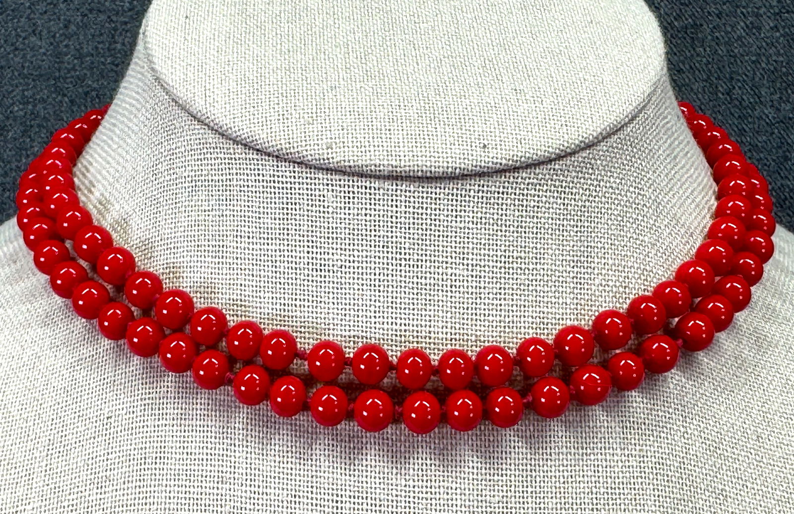 Vintage Monet knotted in between red glass beaded necklace *a: Vintage Monet knotted in between red glass beaded necklace. Marked. For measures please refer to the pictures taken with a measuring tape. Weight: 28 Grams. IN HOUSE FLAT SHIPPING & HANDLING COST WITH