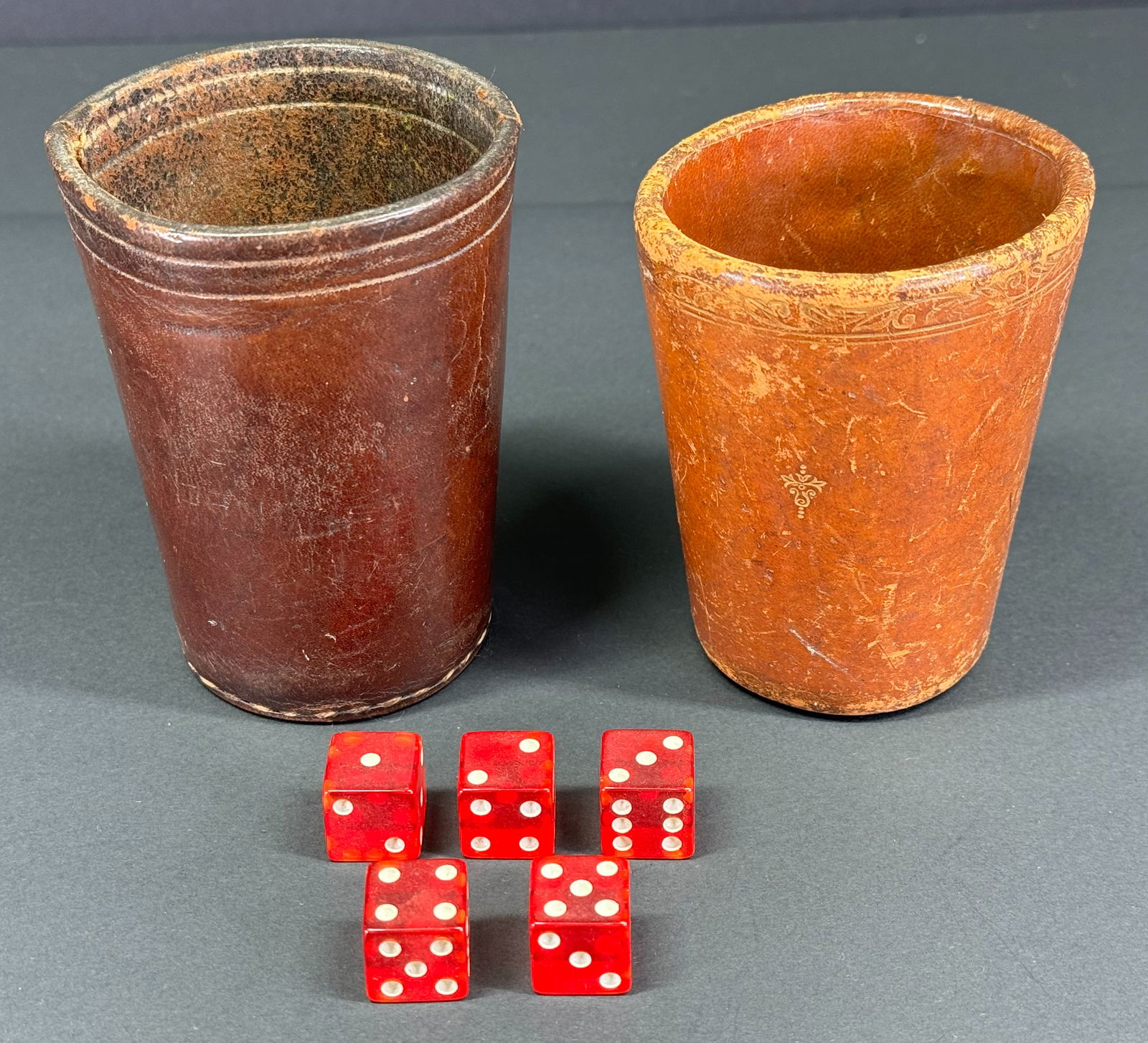 Vintage assorted genuine leather dice shakers and 5 red lucite dice. (1 of 17)