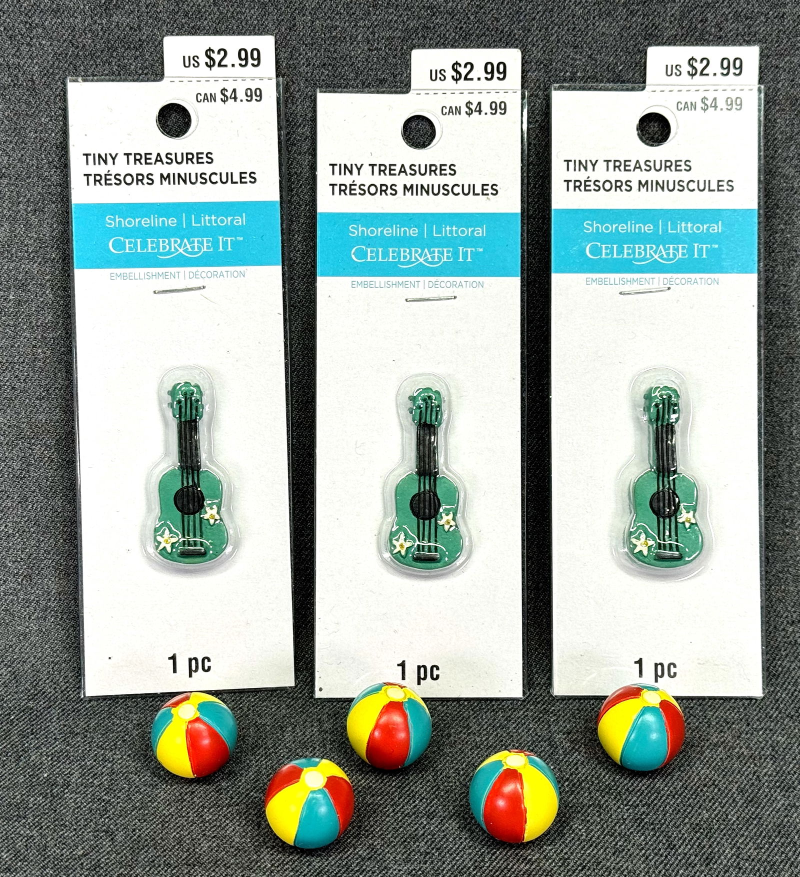 Celebrate It tiny Treasures miniature beach balls & guitars: Celebrate It tiny Treasures miniature 3 decorated with flowers guitars in their original packaging and 5 beach balls. For measures please refer to the pictures taken with a measuring tape. Weight: 62