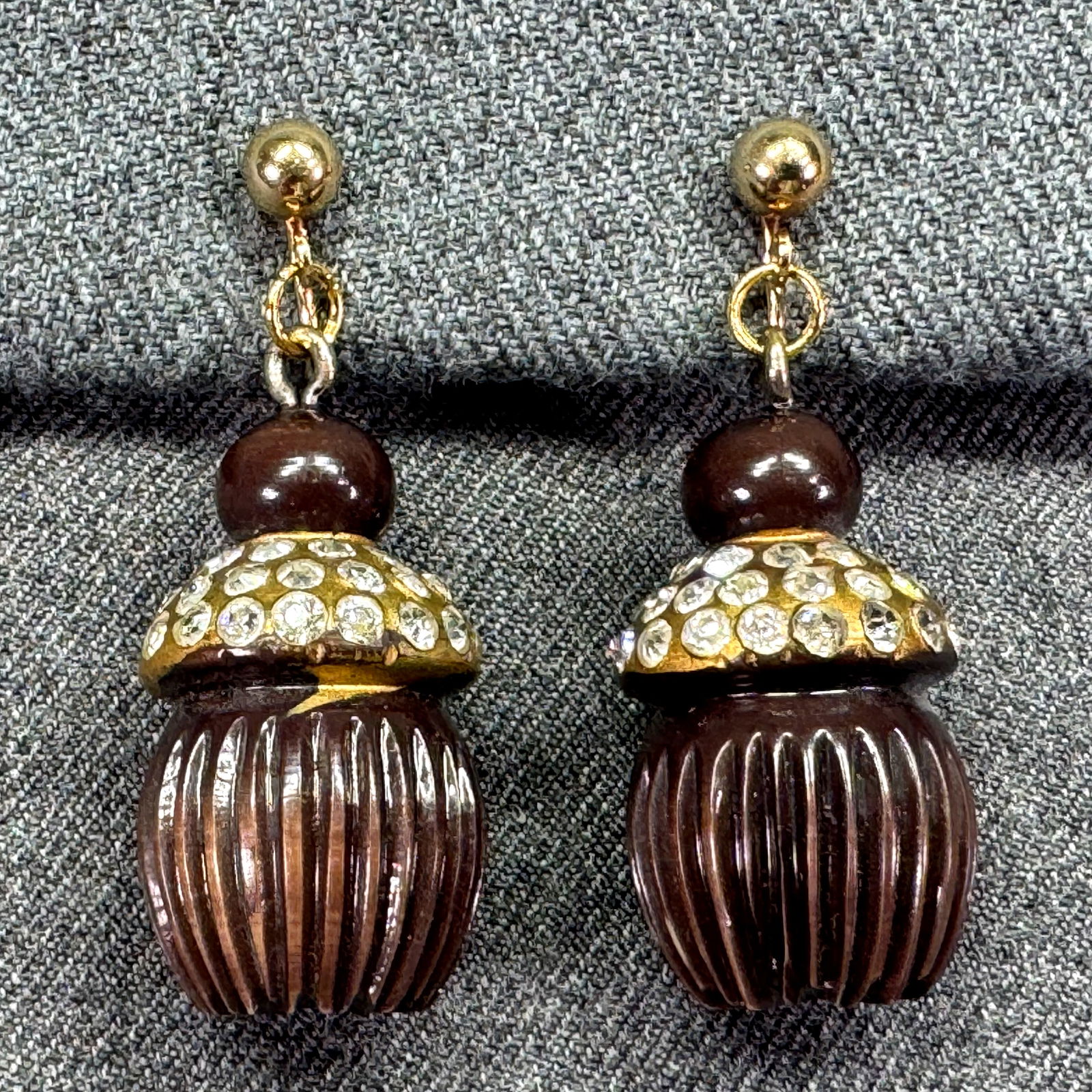 Vintage encrusted crystals celluloid pompom tassel screw earrings: Vintage encrusted crystals gilt brown celluloid pompom tassel gold-toned screw back earrings. Unmarked. For measures please refer to the pictures taken with a measuring tape. Weight: 17 Grams IN HOUSE