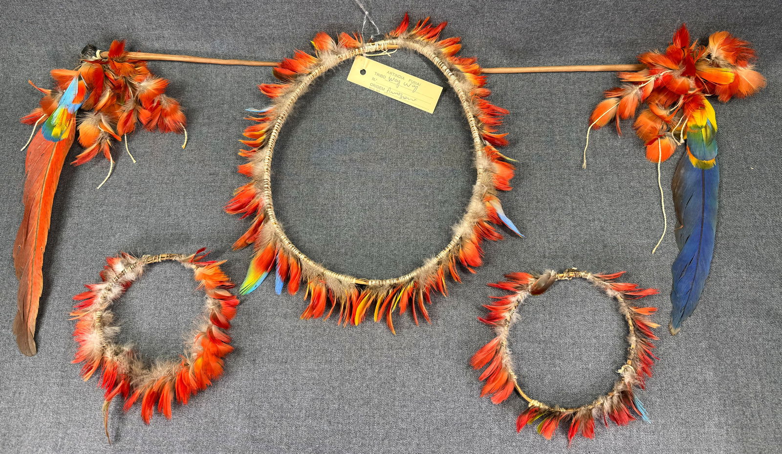 Amazonian Way - Way Set of Body Ornaments. Headdress, armbands, hair pins: Amazonian Way - Way Set of Body Ornaments. Feathers, wood, beeswax, fibers. Comprising: headdress, pair of armbands and pair of hair pins. ,br>The headdress with an old paper label from the FUNAI ( Br