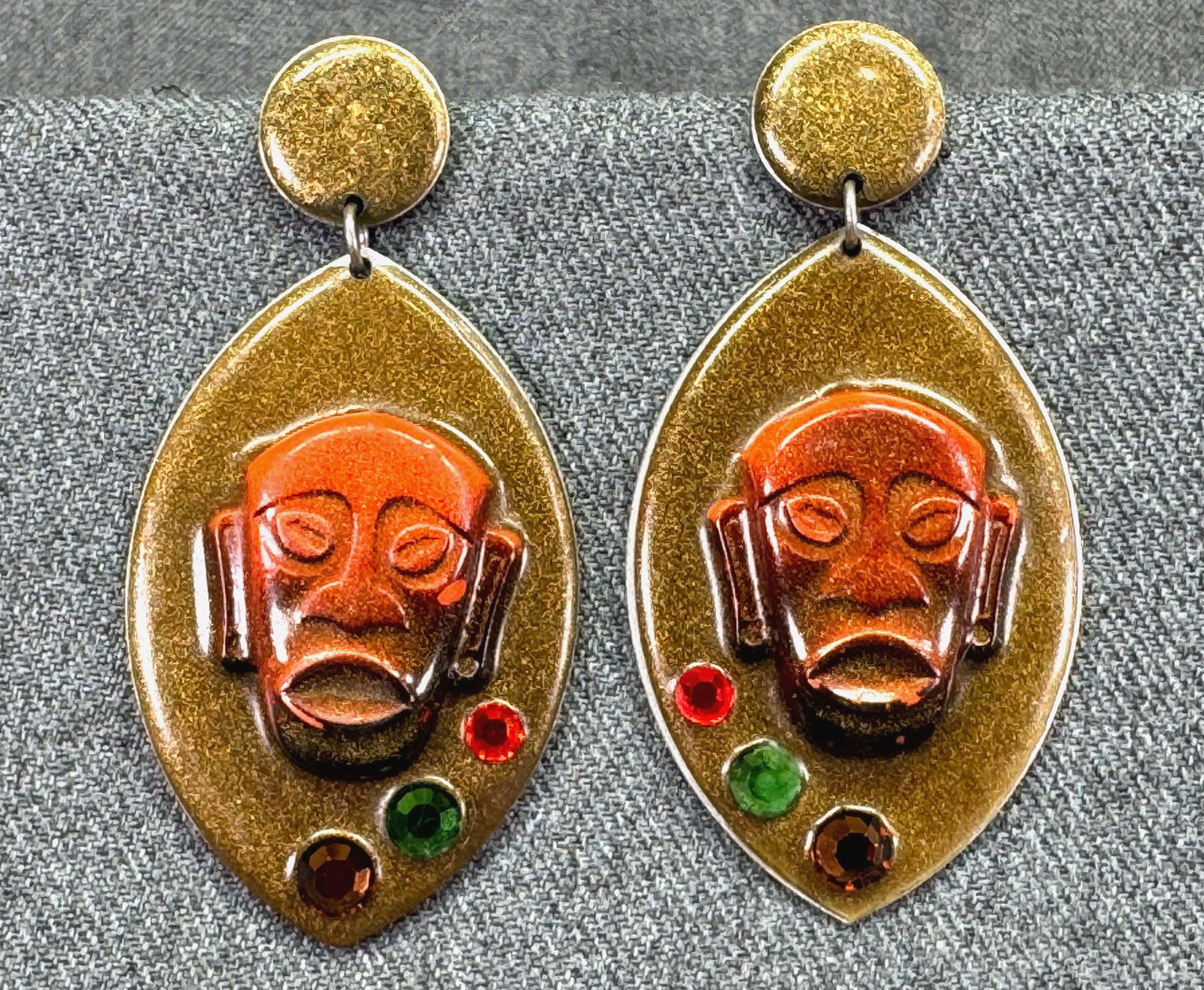 Vintage artsy enamel & jeweled mask aluminum drop stud earrings: Vintage artsy enamel & jeweled mask aluminum drop stud earrings. Unmarked. For measures please refer to the pictures taken with a measuring tape. Weight: 21 Grams. IN HOUSE FLAT SHIPPING & HANDLING CO