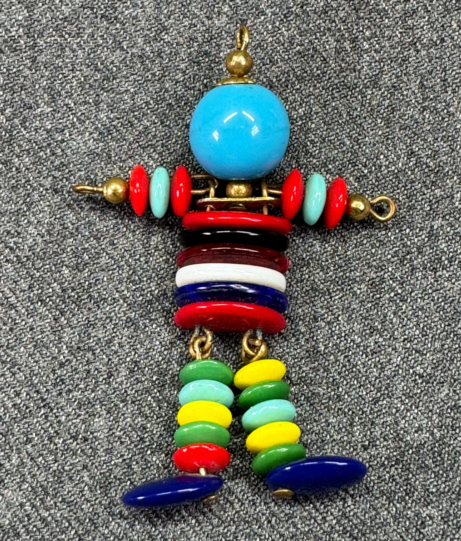 Vintage Czech glass beads figural pendant. Dome belly, working arms and legs *B: Vintage Czech glass beads figural pendant. Dome belly, working arms and legs. Unmarked. For measures please refer to the pictures taken with a measuring tape. Weight: 10 Grams. IN HOUSE FLAT SHIPPING