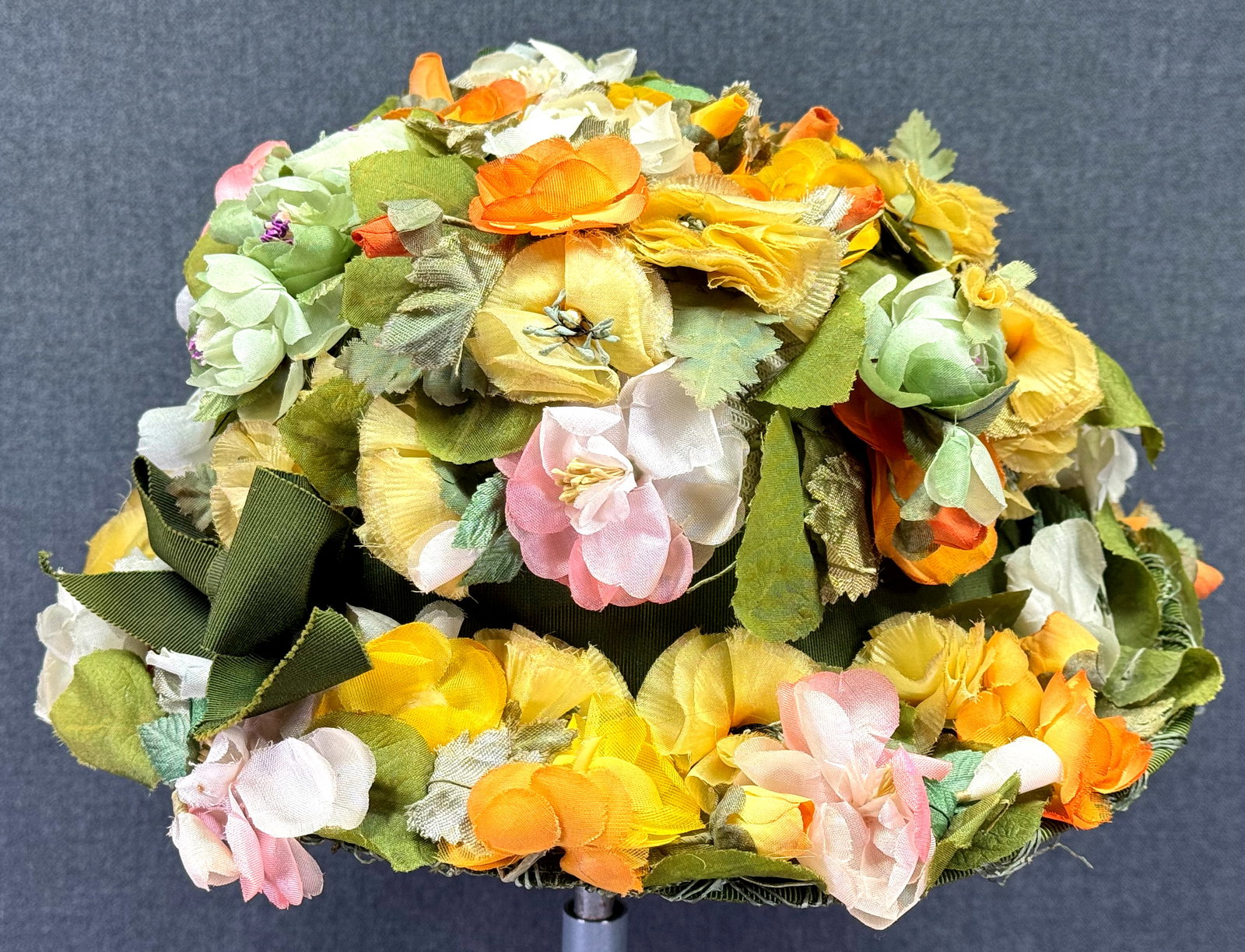 Vintage Adolfo II New York Paris floral hat. *B: Vintage Adolfo II New York Paris floral hat. Green grosgrain ribon band with bow. Fabric label. No size, the interior cincumference measures around 20 1/2 inches. IN HOUSE FLAT SHIPPING & HANDLING COS