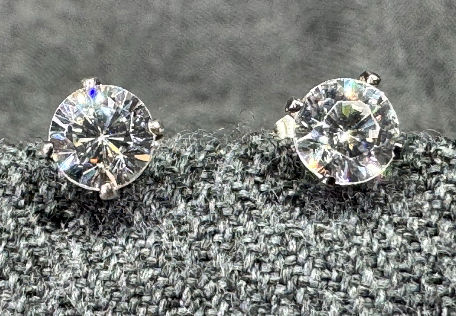 CZ sterling silver stud earrings. #B: CZ sterling silver stud earrings. Marked 925 on the studs. For measures please refer to the pictures taken with a measuring tape. Weight: 0.94 Grams. IN HOUSE FLAT SHIPPING & HANDLING COST WITHIN ALL