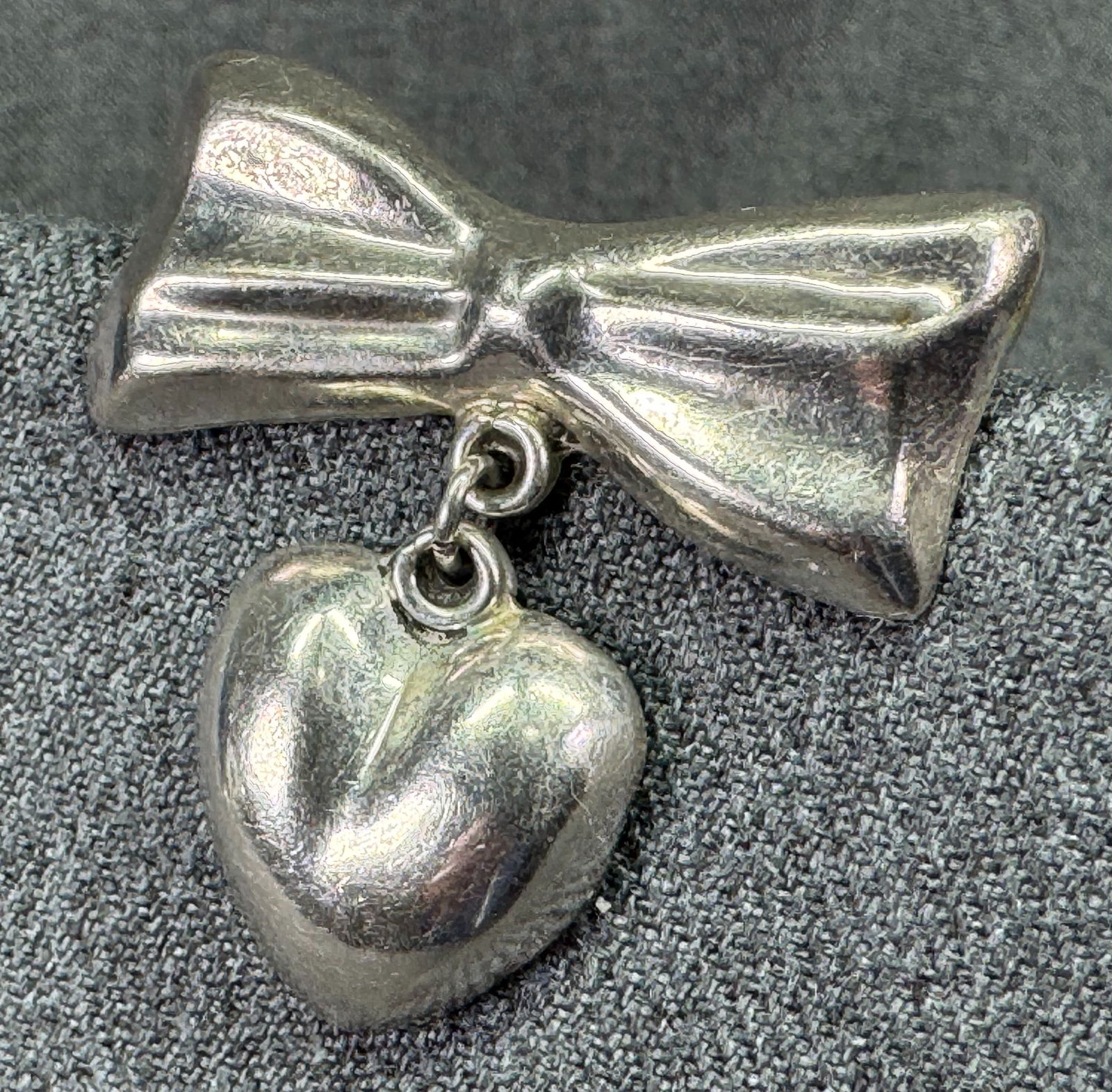 Vintage Mexican sterling silver heart dangling bow single stud earring #B: Vintage Mexican sterling silver heart dangling bow single stud earring . Marked 925 Taxco. For measures please refer to the pictures taken with a measuring tape. Weight: 8.57 Grams. IN HOUSE FLAT SHIP