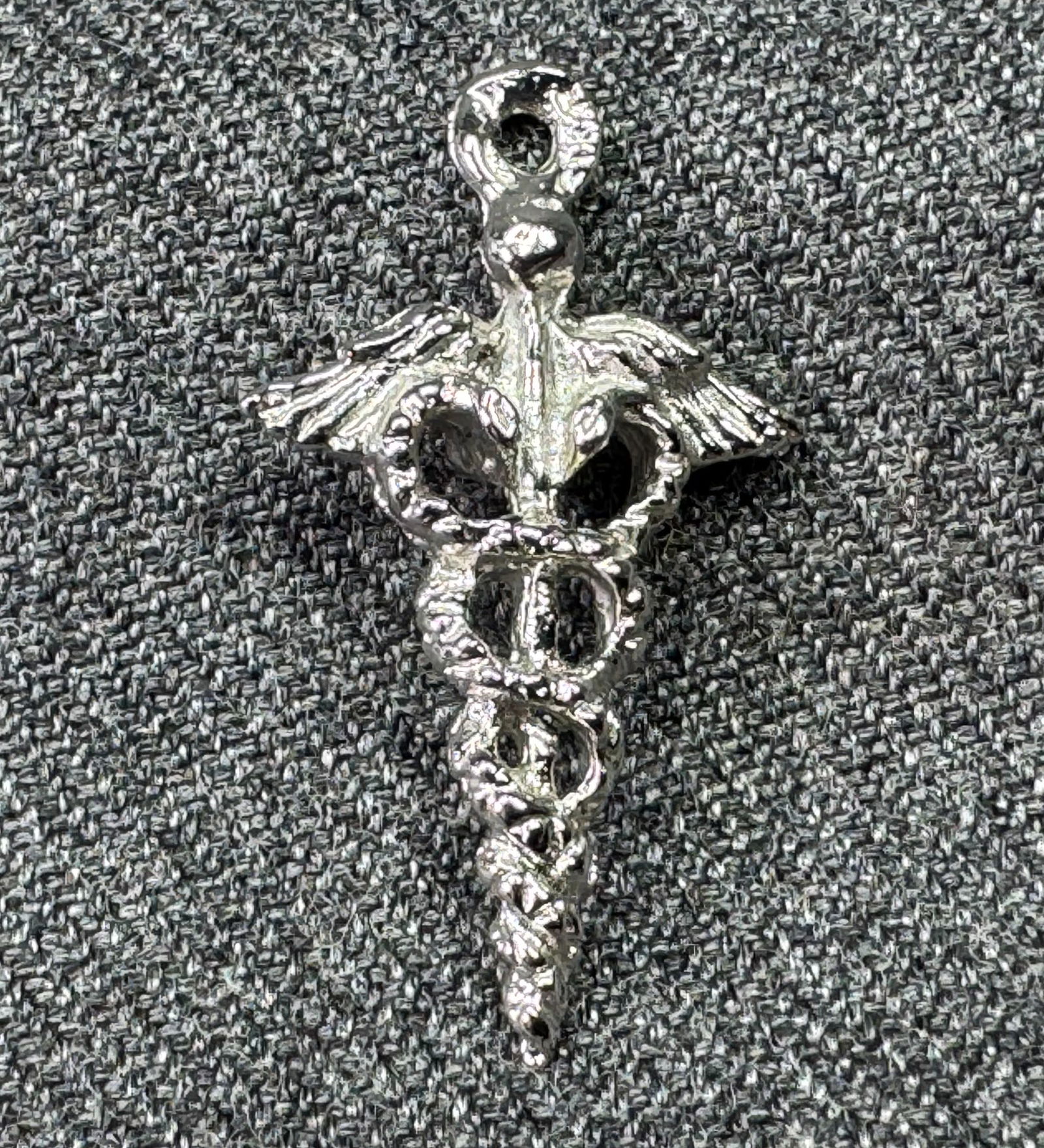Vintage Caduceus medical insignia sterling silver bracelet's charm pendant *B: Vintage Caduceus medical insignia sterling silver bracelet's charm pendant. Marked on bail. For measures please refer to the pictures taken with a measuring tape. Weight: 1.17 Grams. IN HOUSE FLAT SHI