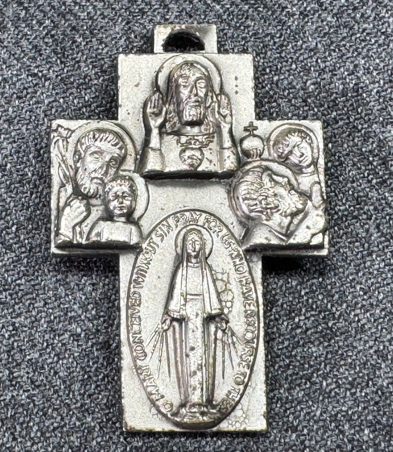Vintage Italian Saints four ways cross pendant: Vintage Italian Saints four ways cross pendant. Marked Italy. For measures please refer to the pictures taken with a measuring tape. Weight: 2 Grams. IN HOUSE FLAT SHIPPING & HANDLING COST WITHIN ALL
