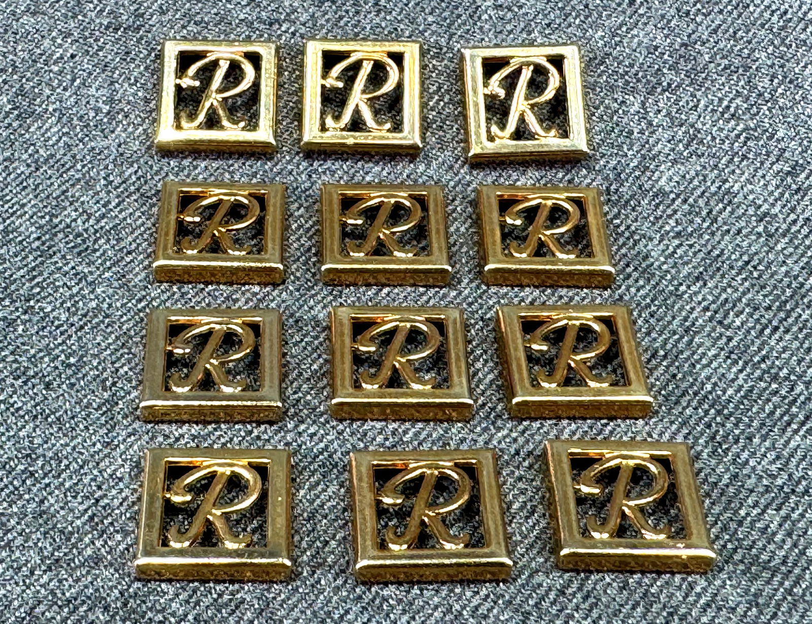 Vintage letter R initial gold-toned appliques embellisments. Lot of 12: Vintage letter R initial gold-toned appliques embellisments. Lot of 12 Unused. For measures please refer to the pictures taken with a measuring tape. Weight: 11 Grams. IN HOUSE FLAT SHIPPING & HANDLIN