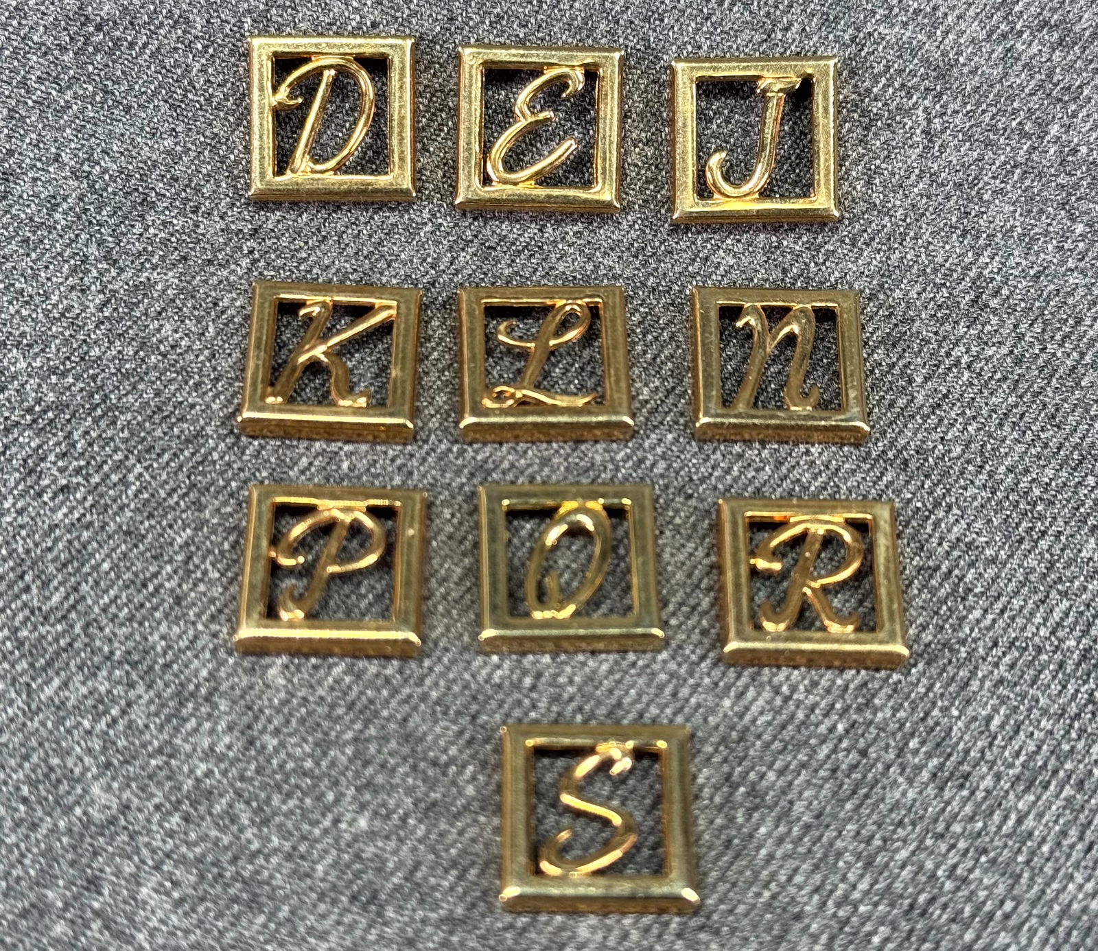 Vintage assorted letter initial gold-toned appliques embellisments. Lot of 10: Vintage assorted letter initial gold-toned appliques embellisments. Lot of 10. Unused. For measures please refer to the pictures taken with a measuring tape. Weight: 11 Grams. IN HOUSE FLAT SHIPPING &