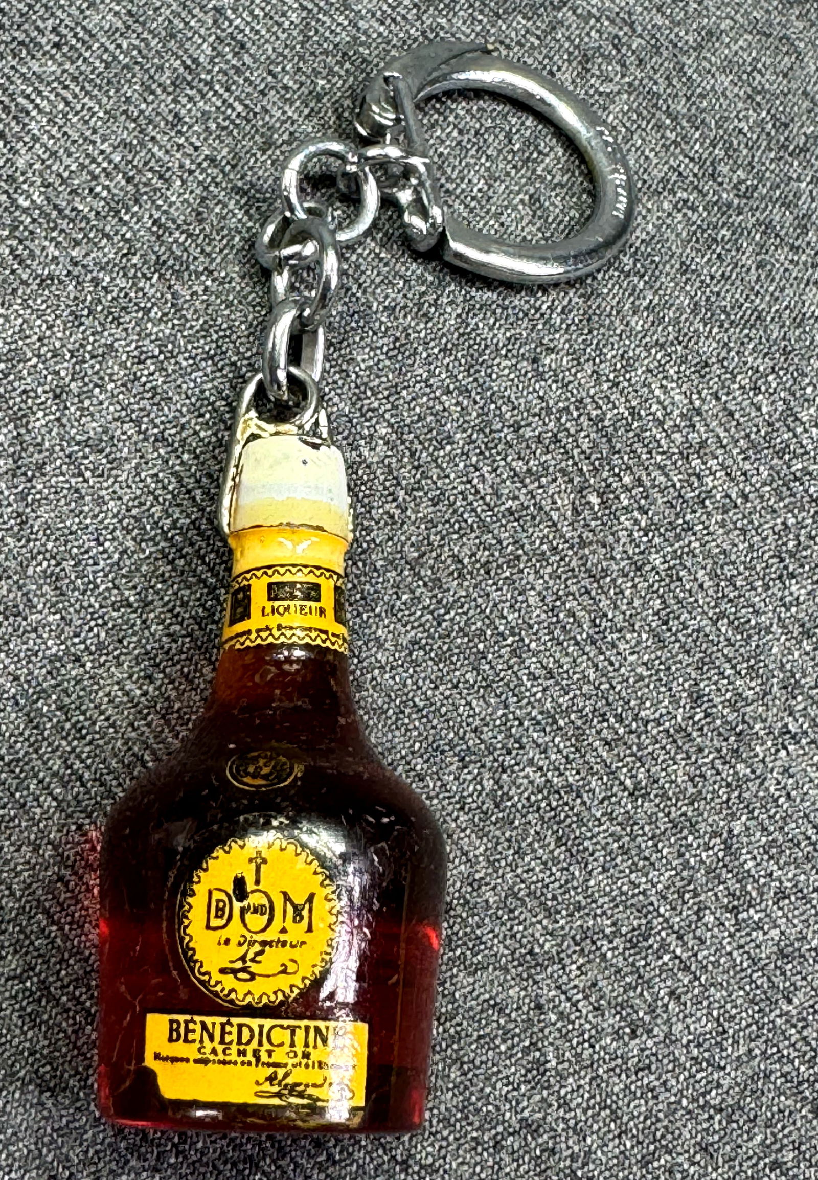 Vintage French Benedictine Dome plastic miniature botte keychain *b: Vintage French Benedictine Dome plastic miniature botte keychain. Ring marked Made in France. For measures please refer to the pictures taken with a measuring tape. Weight:15 Grams. IN HOUSE FLAT SHIP