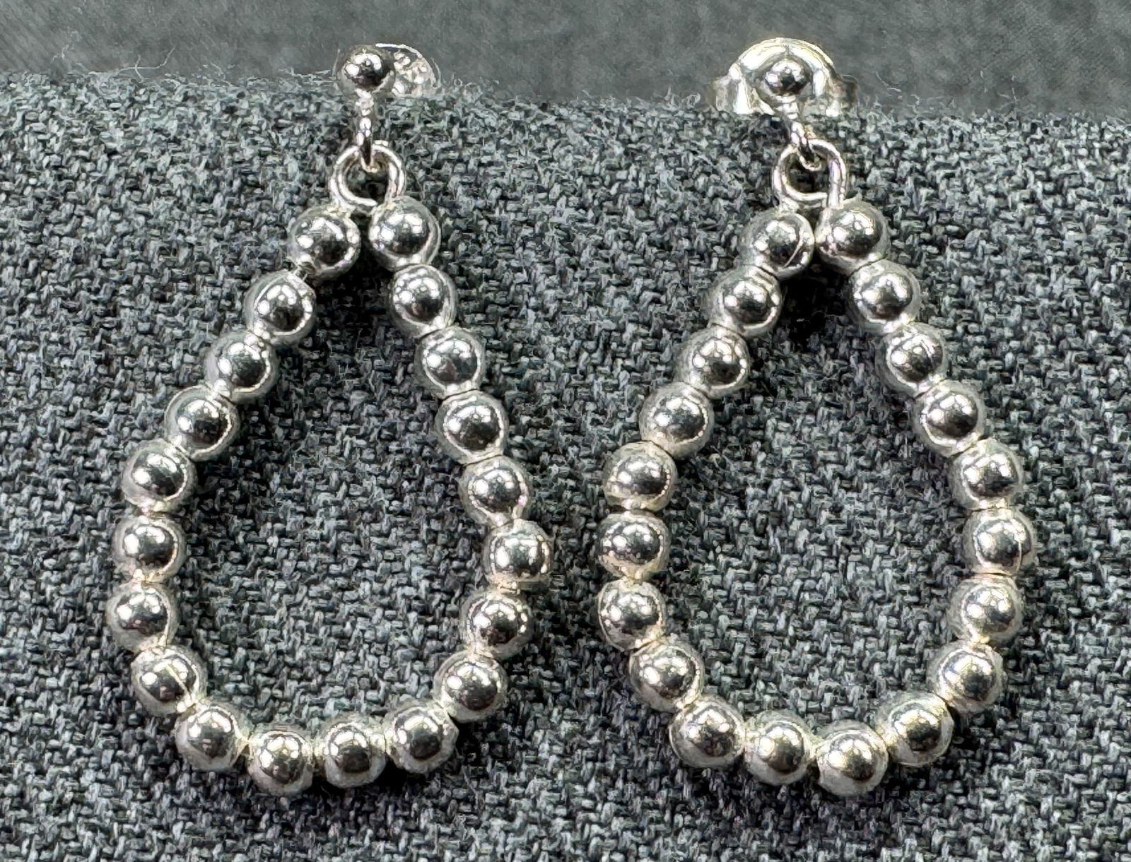 Navajo style sterling silver ball beads dangle stud earrings. a: Navajo style sterling silverball beads dangle stud earrings. Marked. For measures please refer to the pictures taken with a measuring tape. Weight: 3.15 Grams. IN HOUSE FLAT SHIPPING & HANDLING COST W