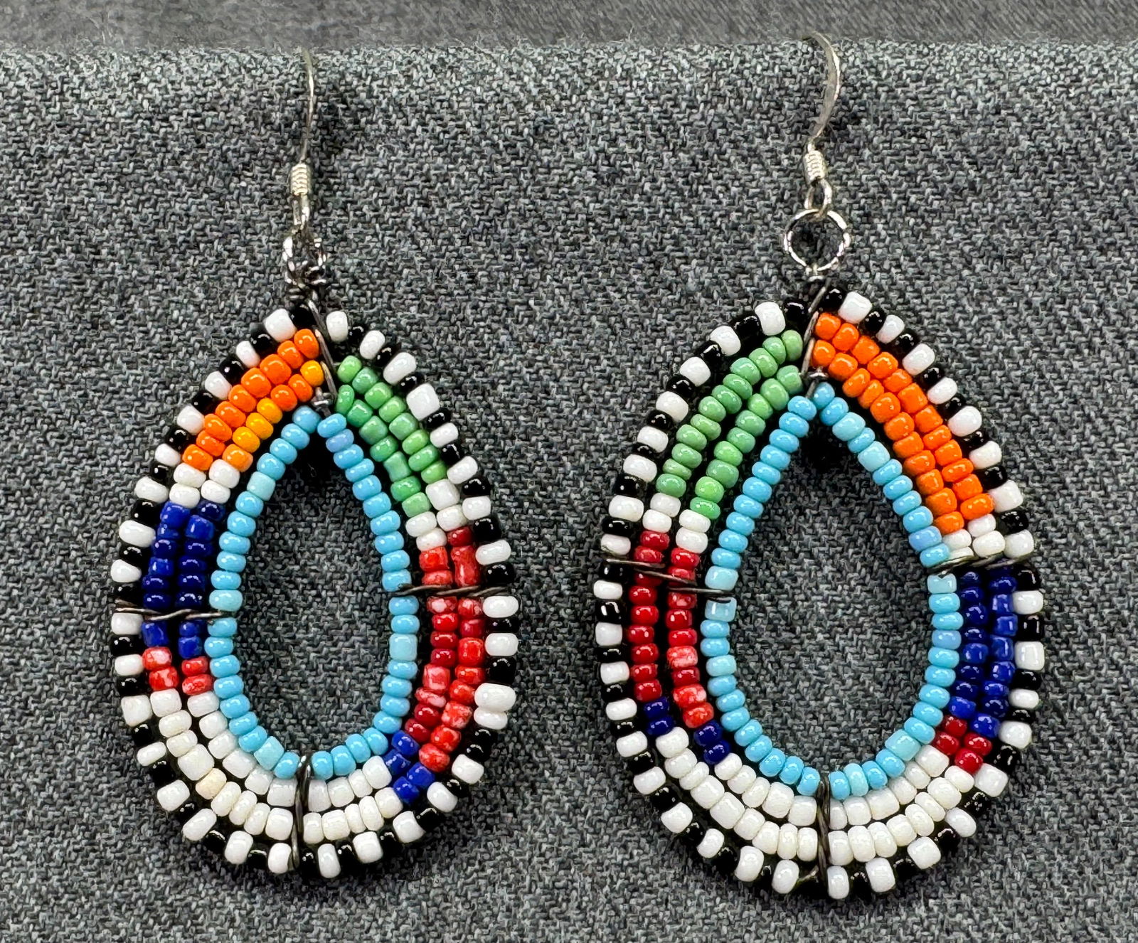 African Masaii beaded dangle hook earrings. #a: African Masaii beaded dangle hook earrings. Unmarked. For measures please refer to the pictures taken with a measuring tape. Weight: 8 Grams. IN HOUSE FLAT SHIPPING & HANDLING COST WITHIN ALL THE U.S.