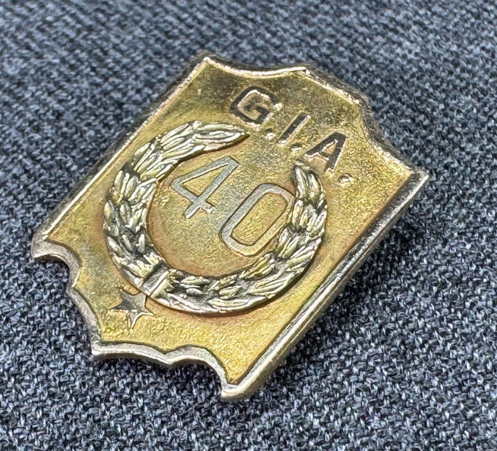 Vintage goldtoned metal G.I.A. 40 Year Lapel Pin: IN HOUSE FLAT SHIPPING & HANDLING COST WITHIN ALL THE U.S. : $7 To bypass LiveShipping, and use our In-House shipping service for $7 or shipping combined for multiple lots, please select “Arrange Yo