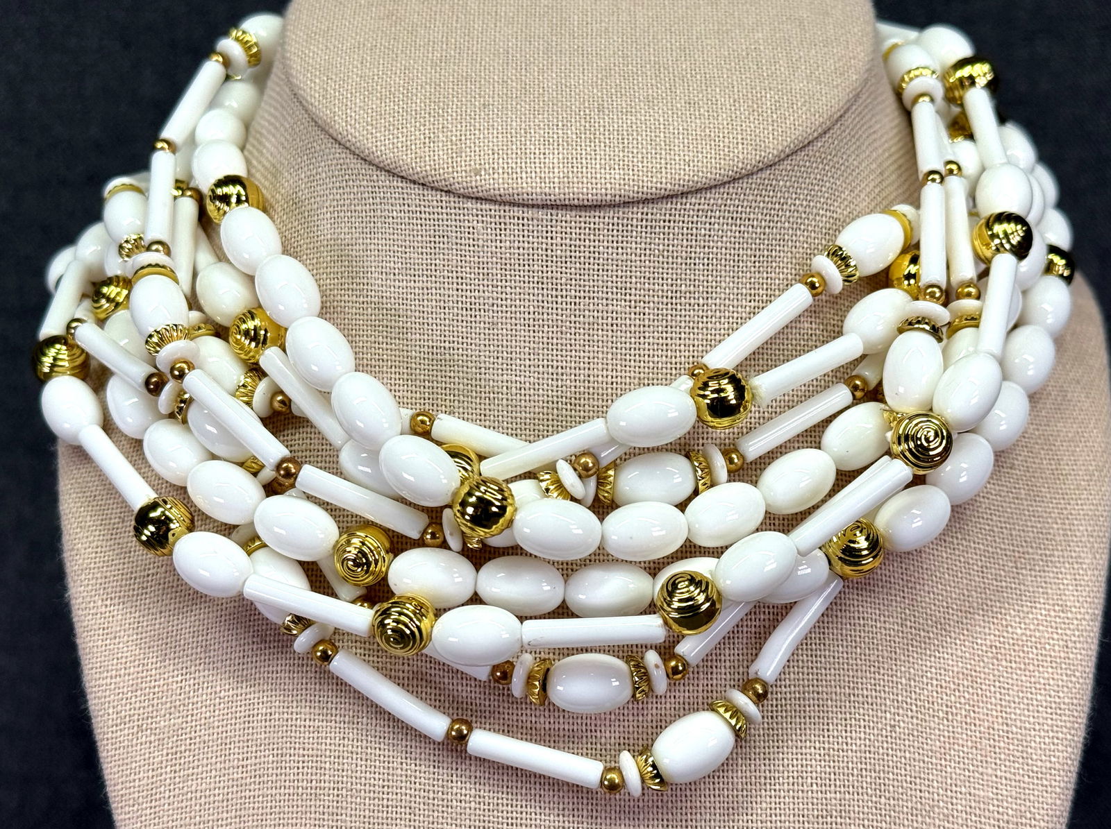Vintage white & gold-toned plastic 4 strands necklace *c: Vintage white & gold-toned plastic 4 strands necklace . For measures please refer to the pictures taken with a measuring tape. Weight: 80 Grams IN HOUSE FLAT SHIPPING & HANDLING COST WITHIN ALL THE U.