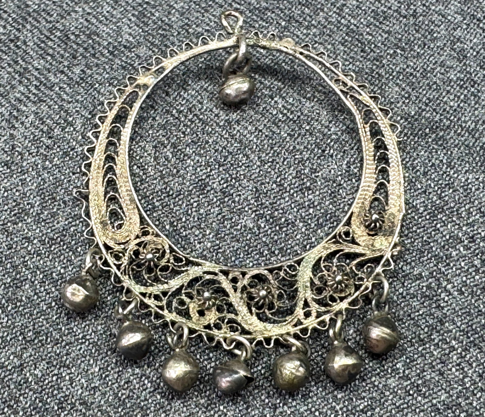 Vintage ethnic sterling silver torque filigree with dangles. *c: Vintage ethnic sterling silver torque filigree with dangles. Unmarked. For measures please refer to the pictures taken with a measuring tape. Weight: 2.50 Grams. IN HOUSE FLAT SHIPPING & HANDLING COST