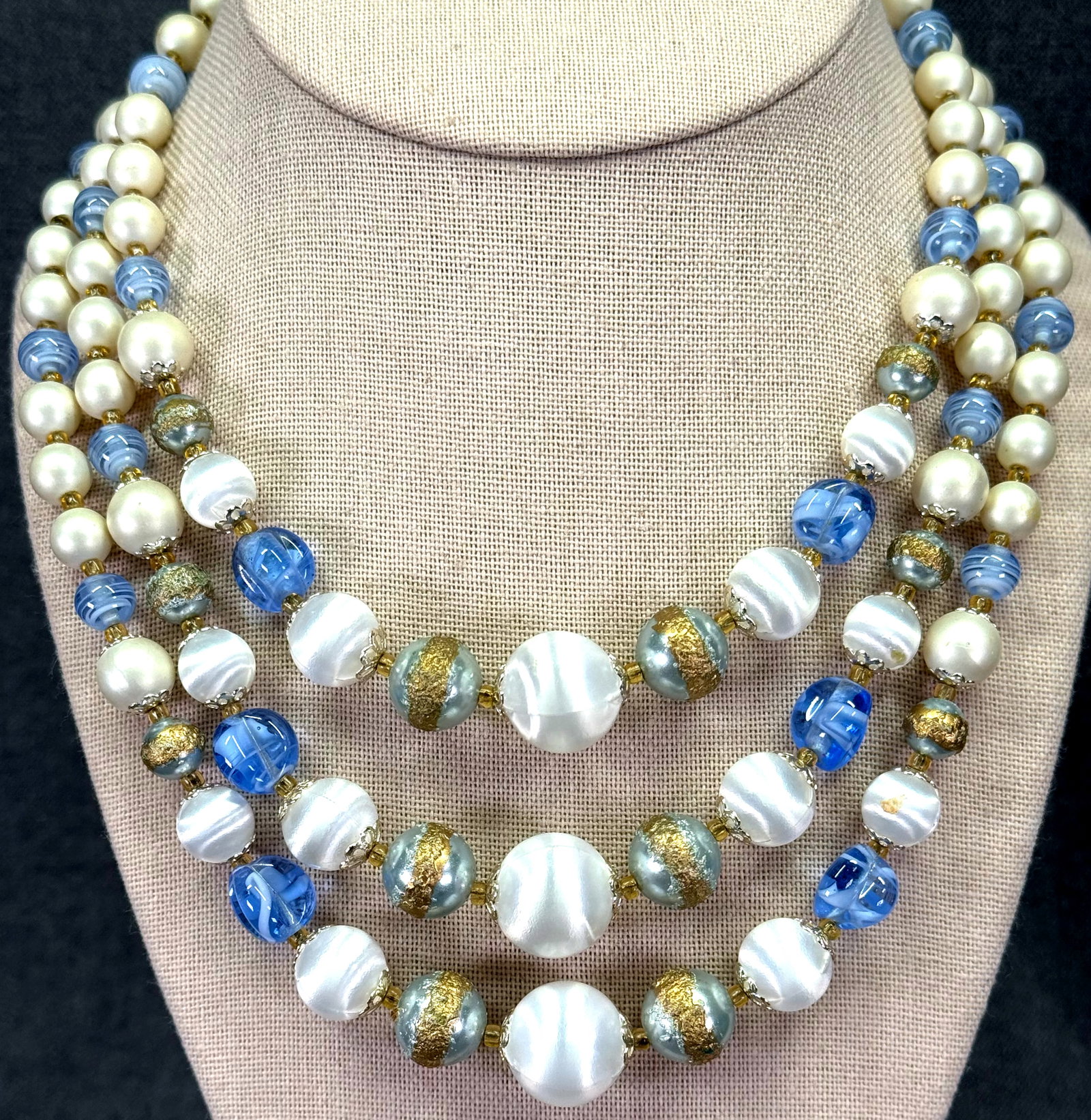 Vintage Japan bluish & creamy assorted beads 3 strands collar necklace.: Vintage Japan bluish & creamy assorted beads 3 strands collar necklace. Marked. For measures please refer to the pictures taken with a measuring tape. Weight: 65 Grams. IN HOUSE FLAT SHIPPING & HANDLI