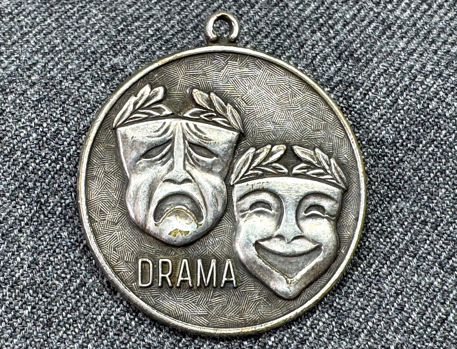 Vintage Drama silver plated medal pendant: Vintage Drama silver plated medal pendant. Unmarked. For measures please refer to the pictures taken with a measuring tape. Weight: 10 Grams. IN HOUSE FLAT SHIPPING & HANDLING COST WITHIN ALL THE U.S.