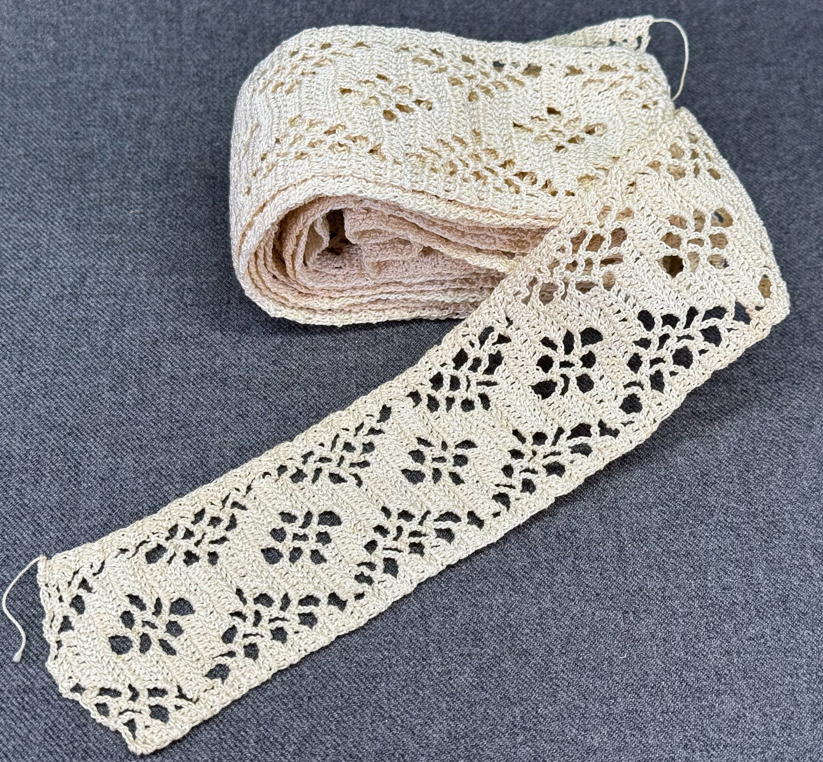 Vintage unused crochet lace trim in V *B: Vintage unused crochet lace trim in V . In one piece with V shape in between, 64 inches on side and 24 inches the other one. For measures please refer to the pictures taken with a measuring tape. Weig