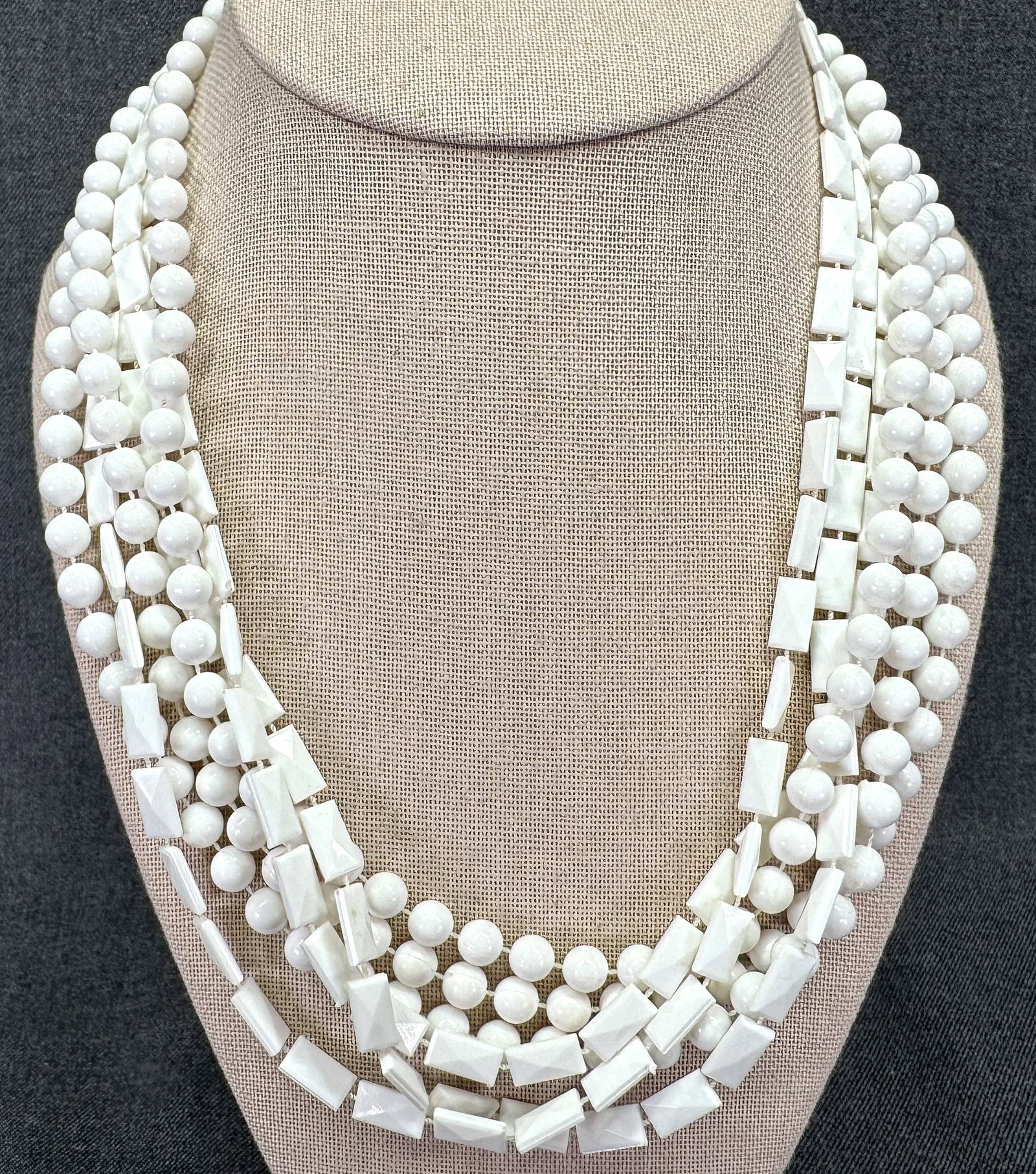 Vintage flapper style white thermoplastic 2 strands necklace. 60" end to end: Vintage flapper style white thermoplastic 2 strands necklace. 60" end to end. Unmarked. For measures please refer to the pictures taken with a measuring tape. Weight: 43 Grams. IN HOUSE FLAT SHIPPING