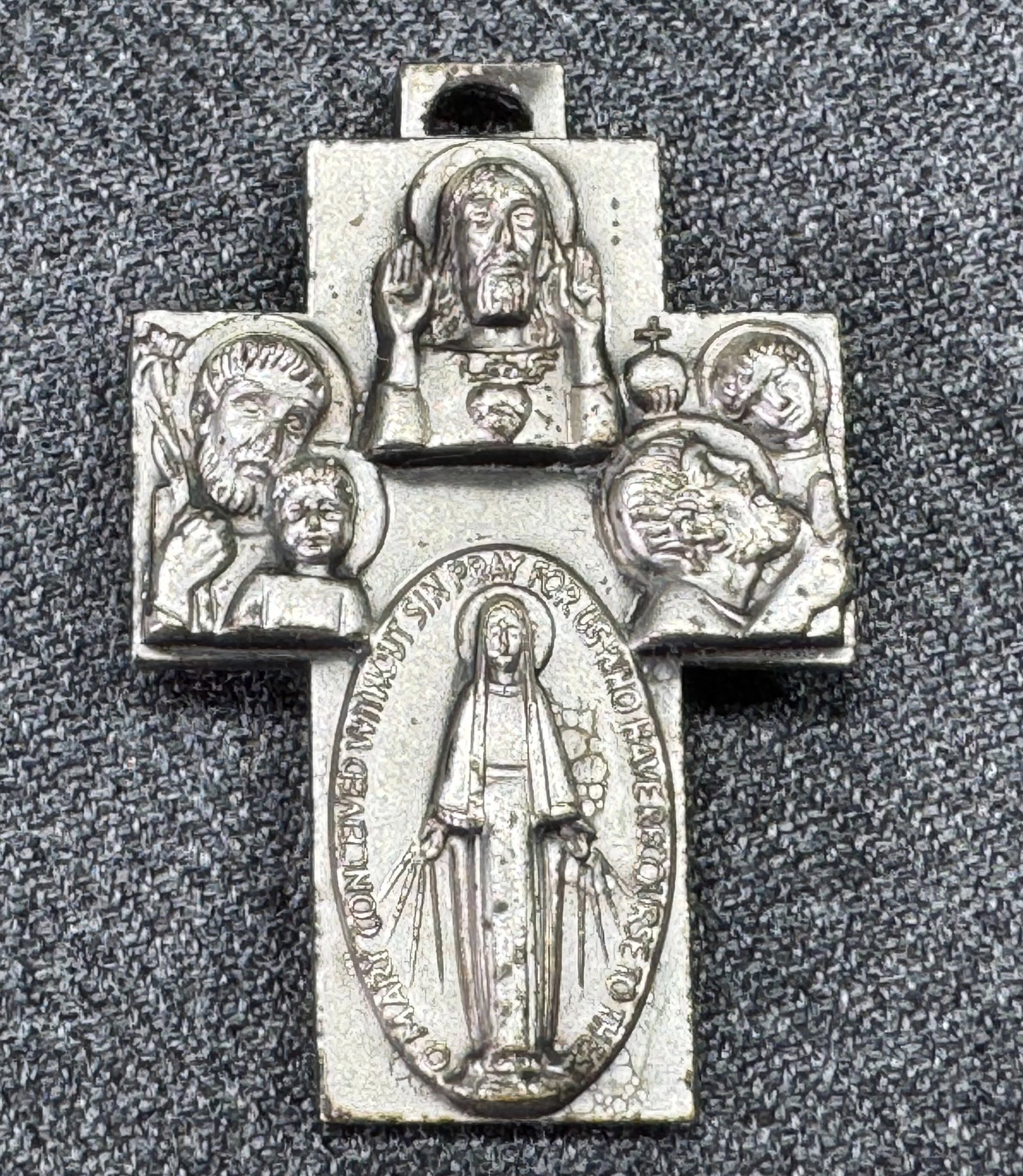 Vintage Italian Saints four ways cross pendant: Vintage Italian Saints four ways cross pendant. Marked Italy. For measures please refer to the pictures taken with a measuring tape. Weight: 2 Grams. IN HOUSE FLAT SHIPPING & HANDLING COST WITHIN ALL