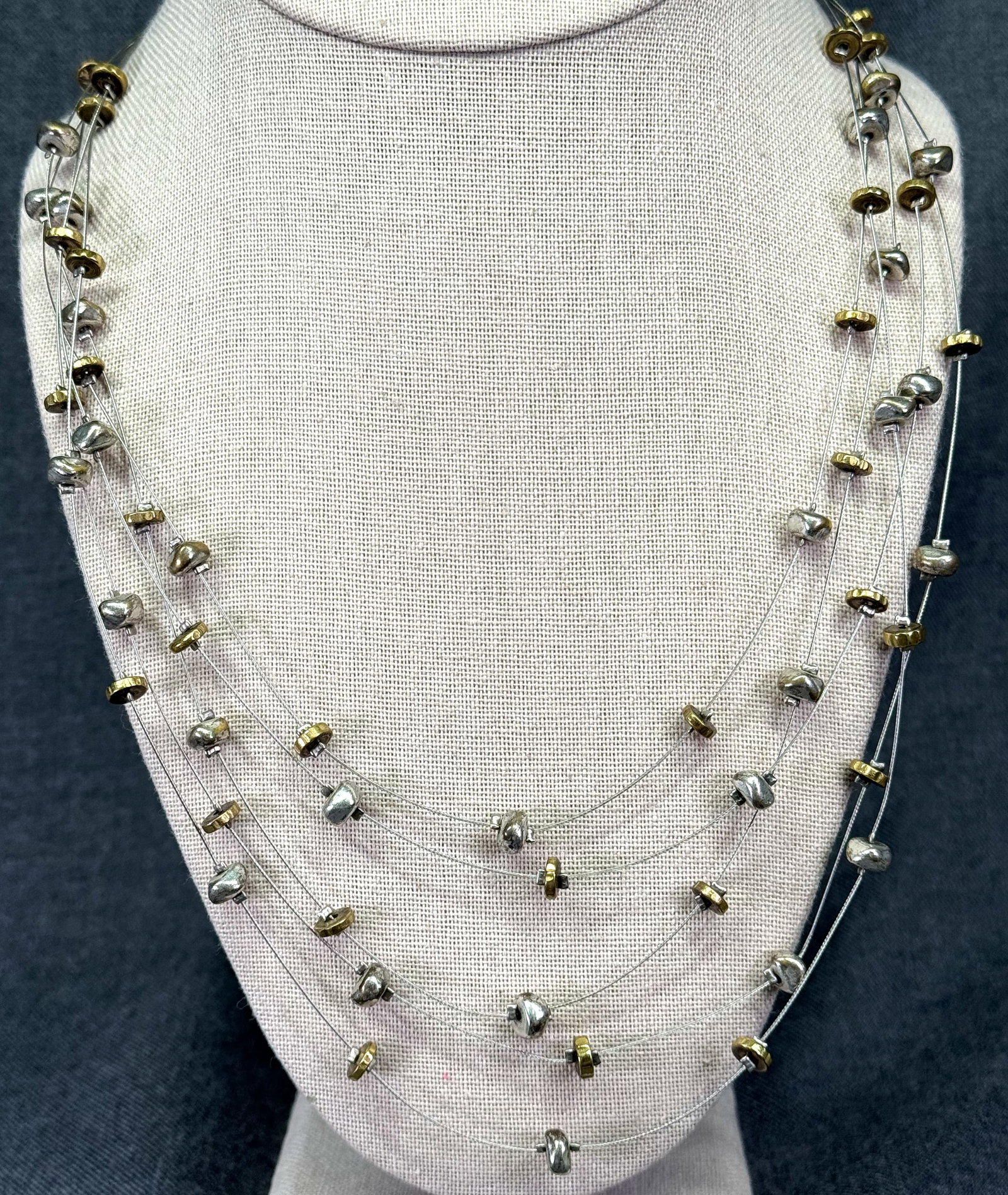 Vintage wired golden & silver beads 5 strands layered necklace. *d: Vintage wired golden & silver beads 5 strands layered necklace. Unmarked. For measures please refer to the pictures taken with a measuring tape. Weight: 38 Grams. IN HOUSE FLAT SHIPPING & HANDLING COS