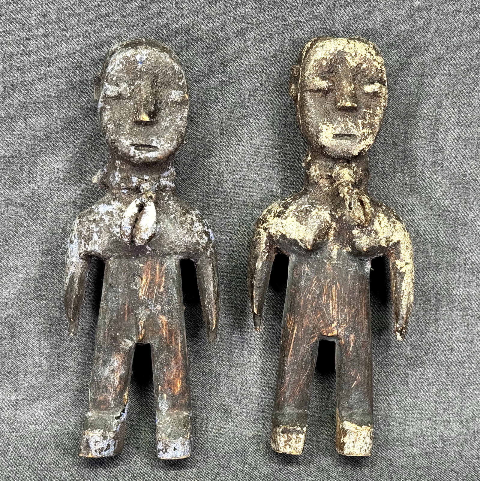 Pair of African Ewe Togo Fetish Figures. *c: Pair of African Ewe Togo Fetish Figures.Carved wood, cowrie shells, pigment. For measures please refer to the pictures taken with a measuring tape. IN HOUSE FLAT SHIPPING & HANDLING COST WITHIN ALL TH