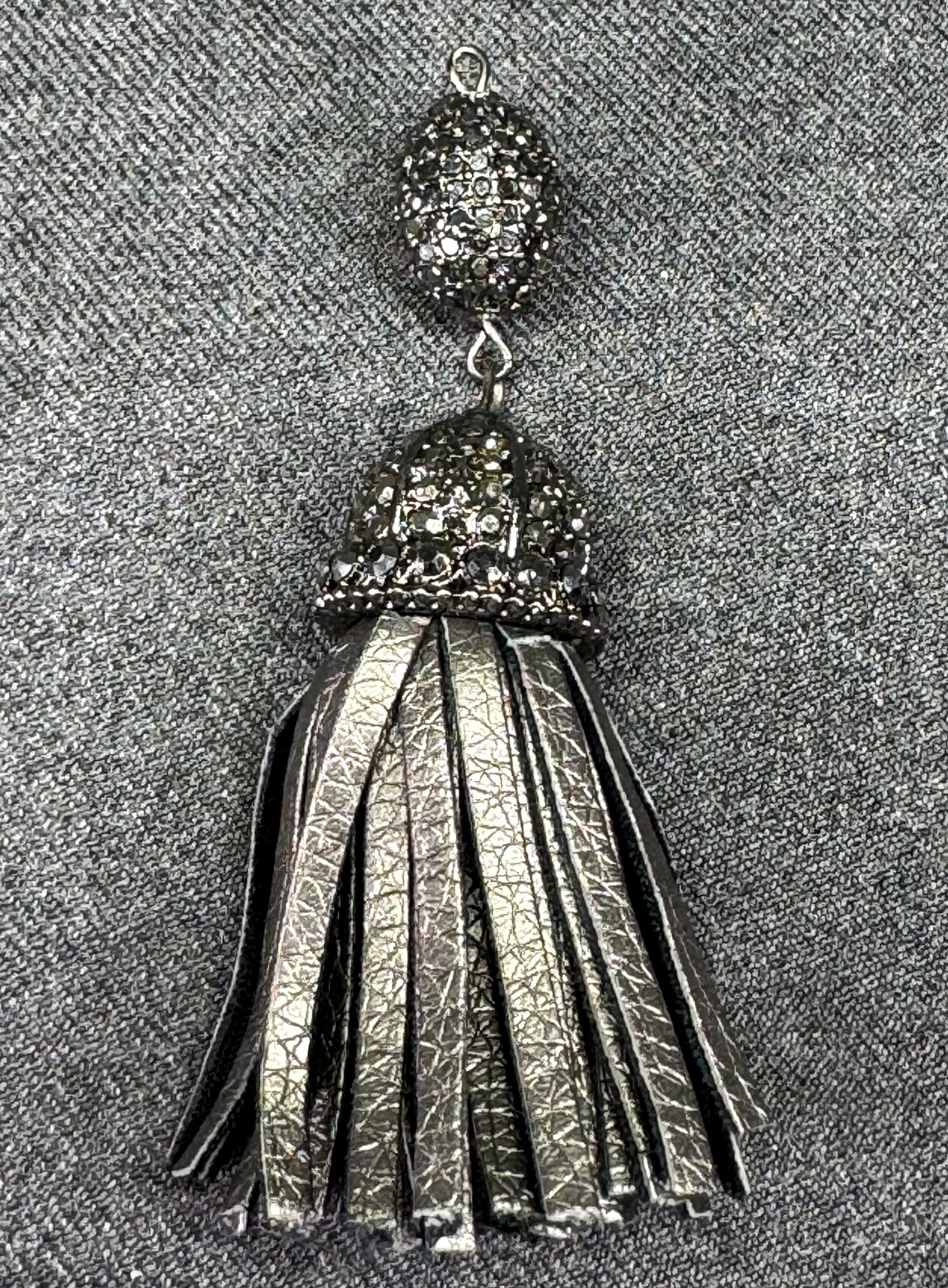 Vintage jeweled crystals metal faux leather tassel pendant. *d: Vintage jeweled crystals metal faux leather tassel pendant. Unmarked. For measures please refer to the pictures taken with a measuring tape. Weight: 18 Grams. IN HOUSE FLAT SHIPPING & HANDLING COST WI