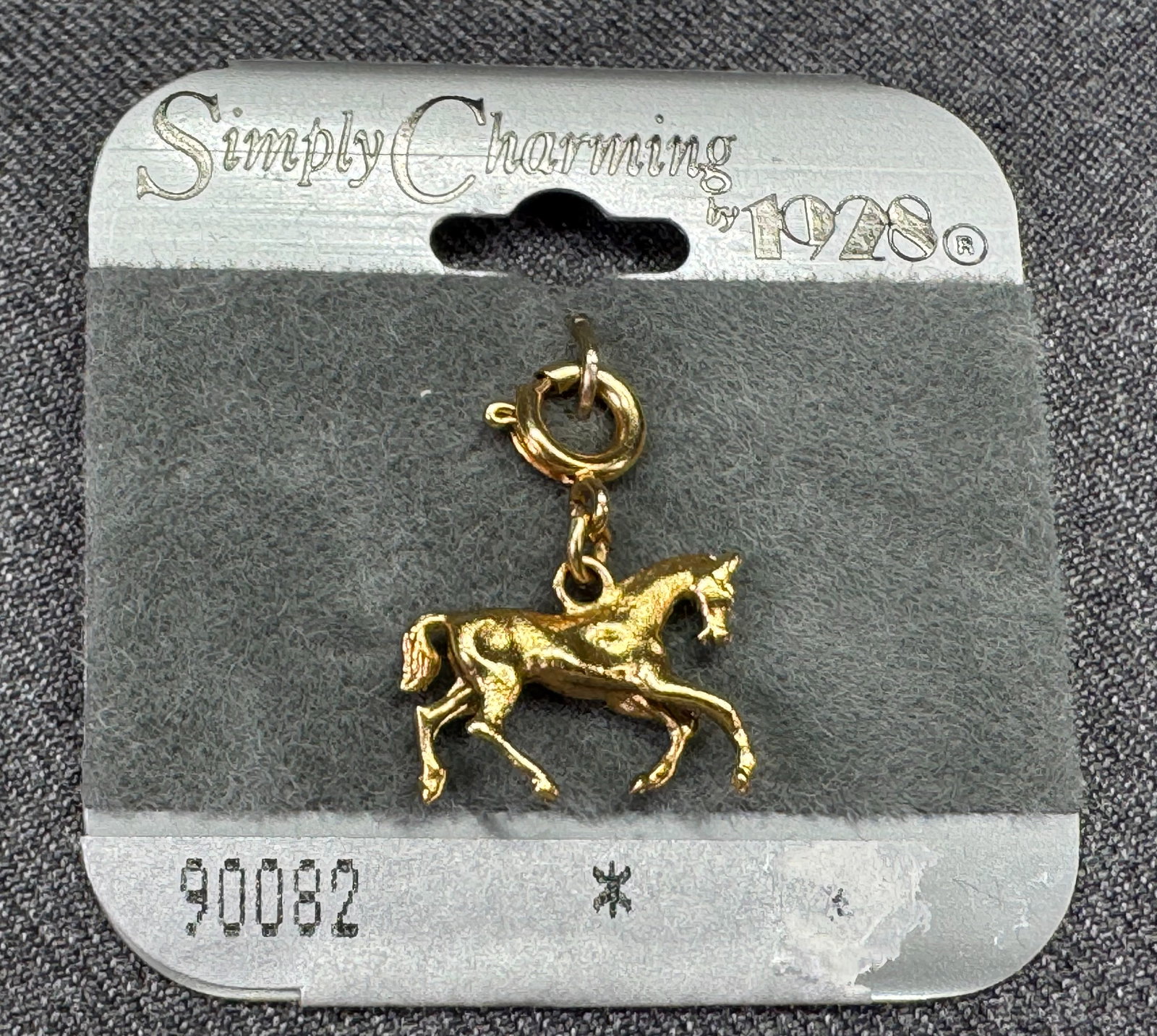 Vintage Simply Charming by 1928 horse pendant charm. Unused in card. *f: Vintage Simply Charming by 1928 horse pendant charm. Unused in card. Gold-toned For measures please refer to the pictures taken with a measuring tape. Weight: 4 Grams. IN HOUSE FLAT SHIPPING & HANDLIN
