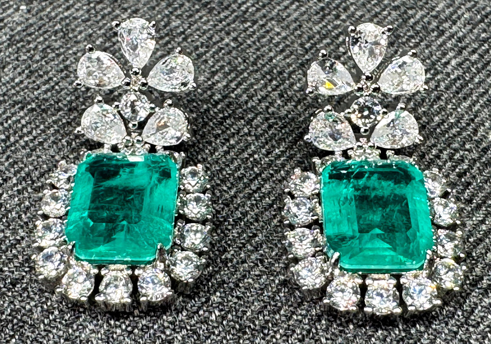 18K White Gold Stud Earrings. Marked AU 750: 18K White Gold Stud Earrings. Marked AU 750. Jeweled with Soude Emerald (imitation gemstone made by layering colorless quartz, beryl, or spinel with a vibrant green adhesive in the middle to mimic a n