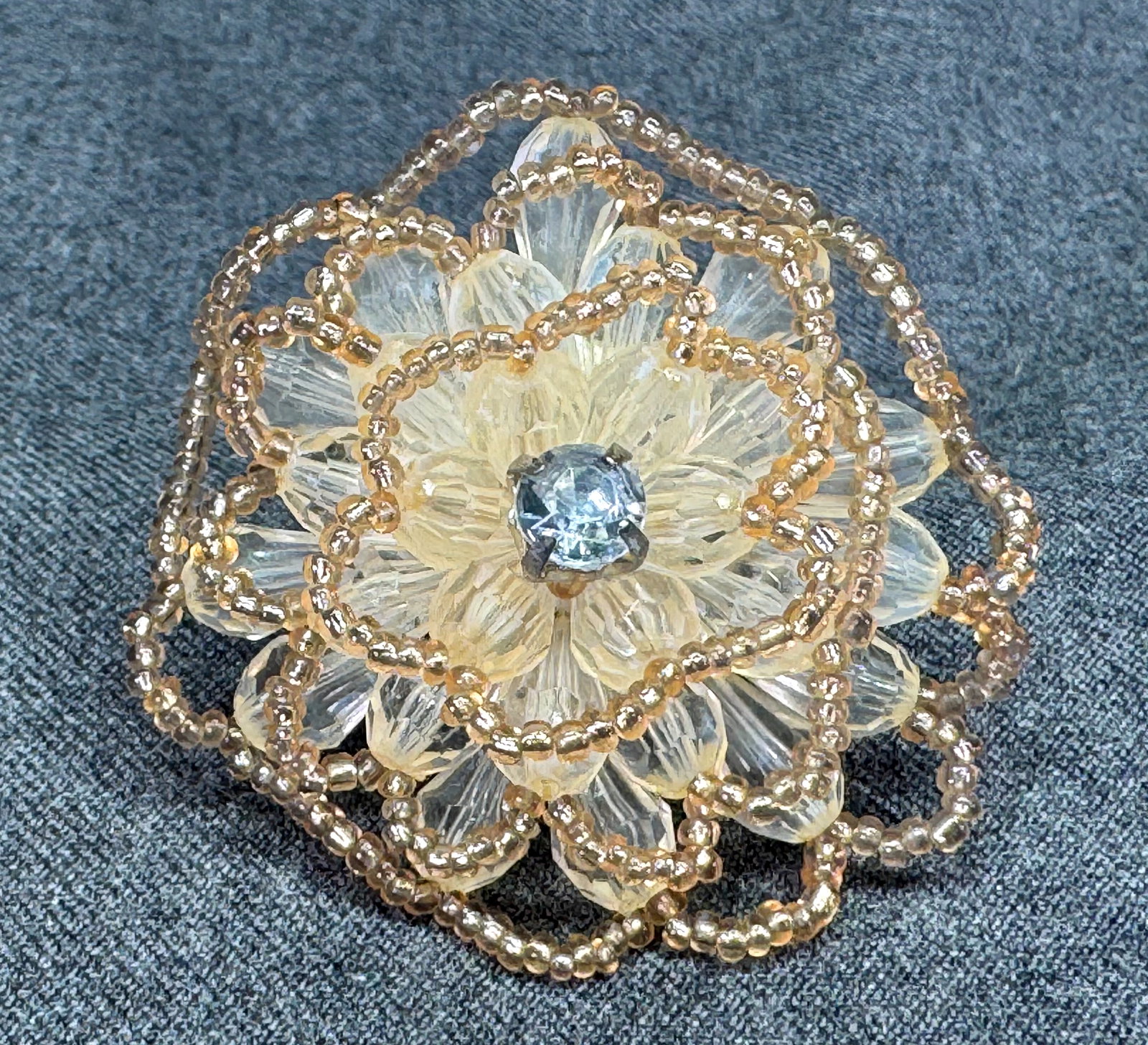 Vintage artisan crystal beaded flower oversized adjustable ring. 2 Inches. *e: Vintage artisan crystal beaded flower oversized adjustable ring. 2 Inches in diameter. Silver-toned. Unmarked. For measures please refer to the pictures that were taken with a measuring tape. Weight: 