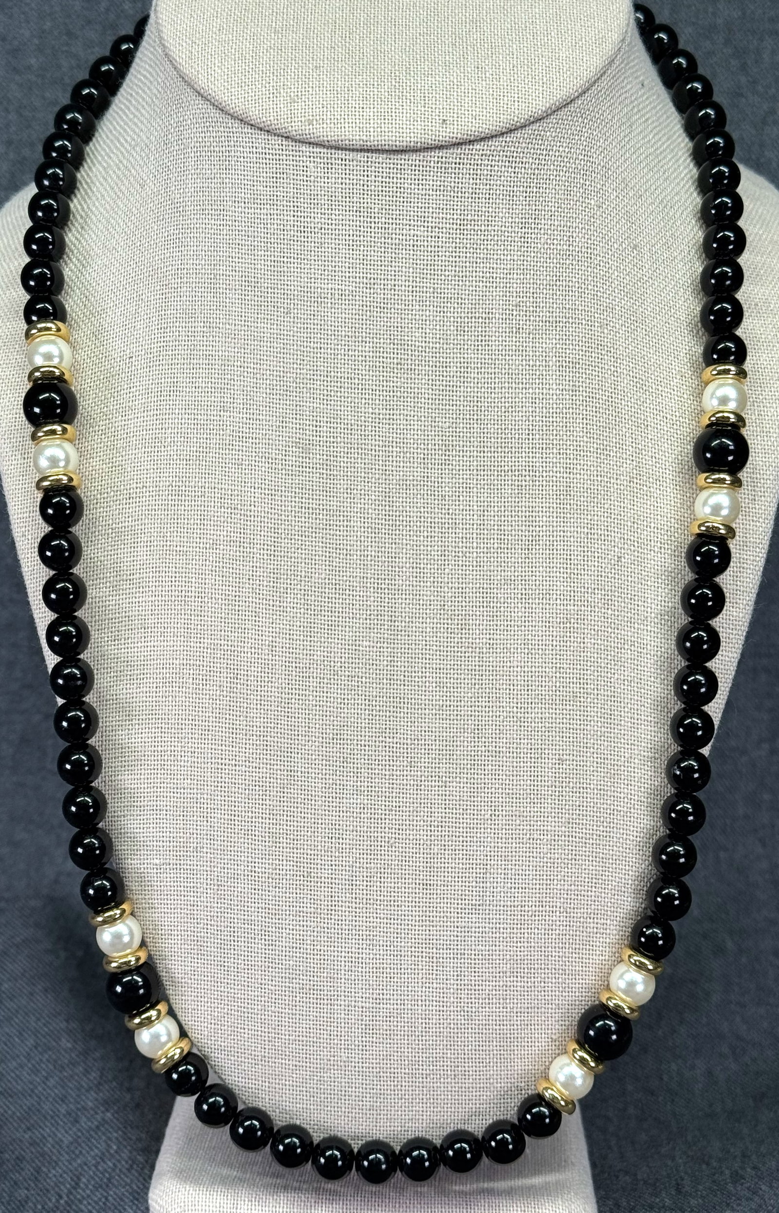 Vintage Napier black, pearly and golden beads necklace. *a: Vintage Napier black, pearly and golden beads necklace. Marked. For measures please refer to the pictures taken with a measuring tape. Weight: 38 Grams. IN HOUSE FLAT SHIPPING & HANDLING COST WITHIN A