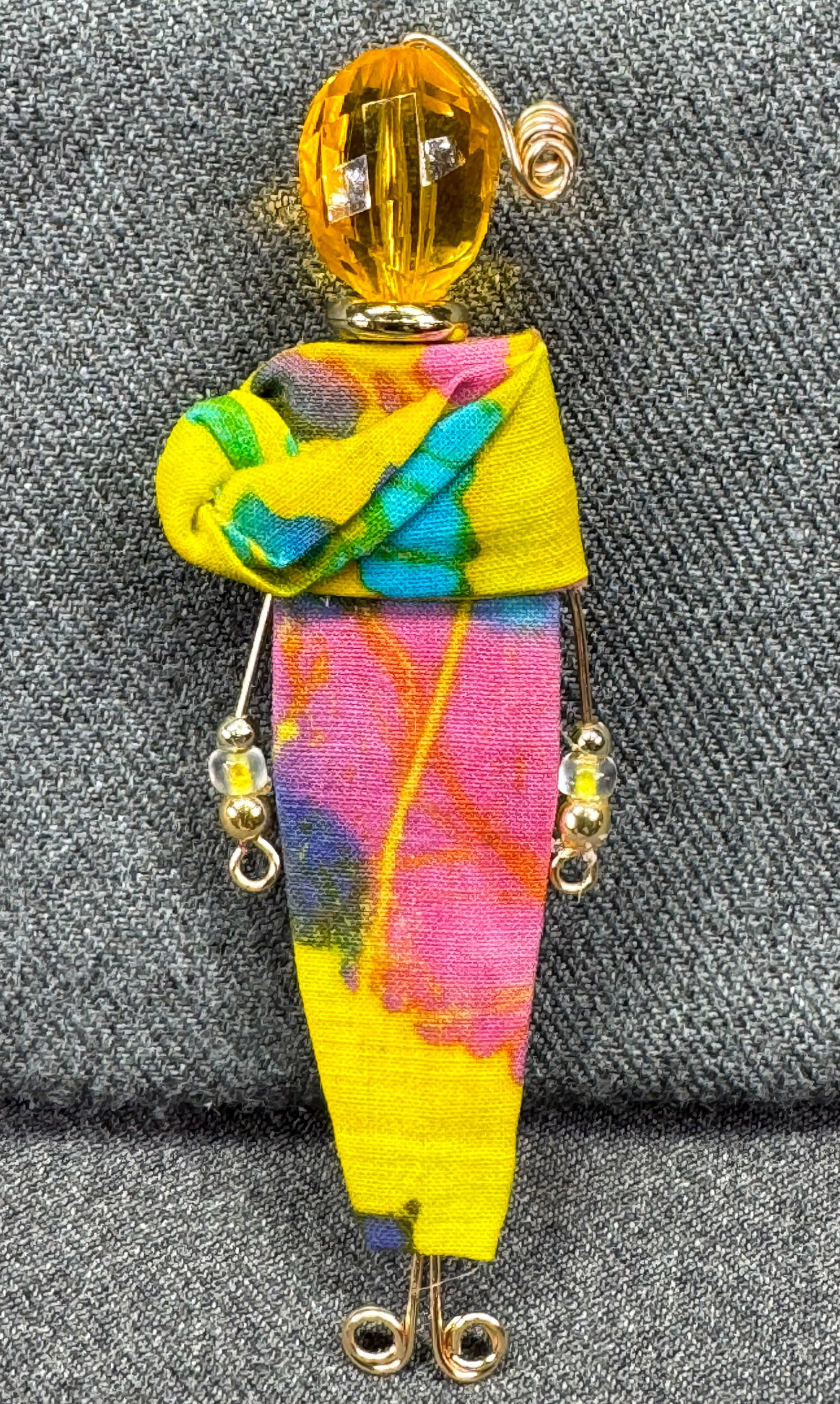 Vintage artsy Joyce Stokes woman large brooch pin. Unused. *c: Vintage artsy Joyce Stokes hand crafted woman large brooch pin. Marked. Original carboard. Fabric gold-toned meta, plastic & glass beads. For measures please refer to the pictures taken with a measuri