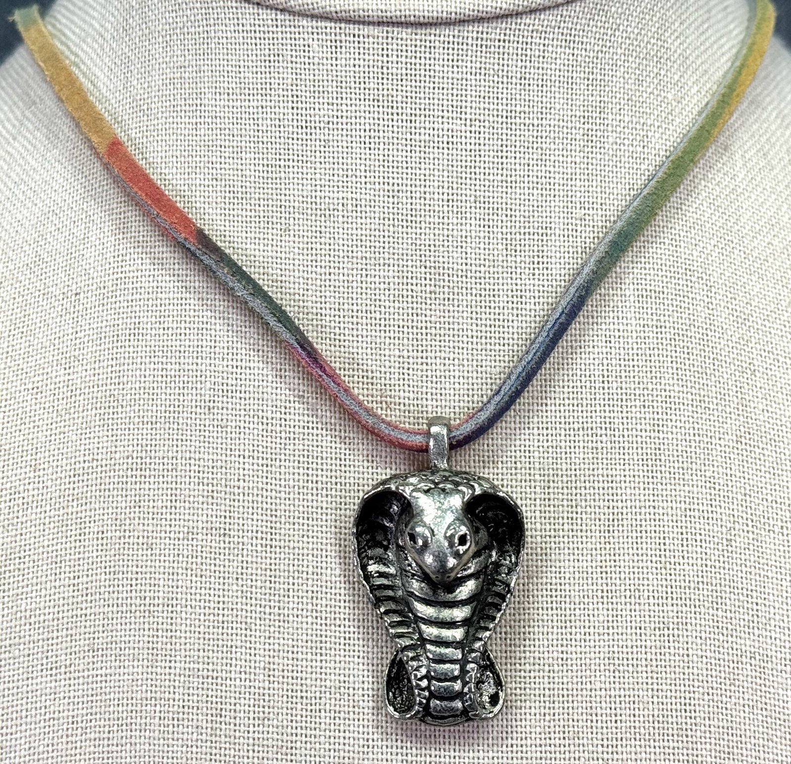 Black accents silvertoned metal cobra pendant colored leather strap necklace: IN HOUSE FLAT SHIPPING & HANDLING COST WITHIN ALL THE U.S. : $7 To bypass LiveShipping, and use our In-House shipping service for $7 or shipping combined for multiple lots, please select “Arrange Yo
