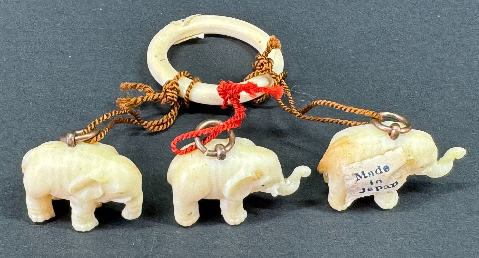 Vintage Japanese celluloid ring with 3 elephant charms dangles. (1 of 8)