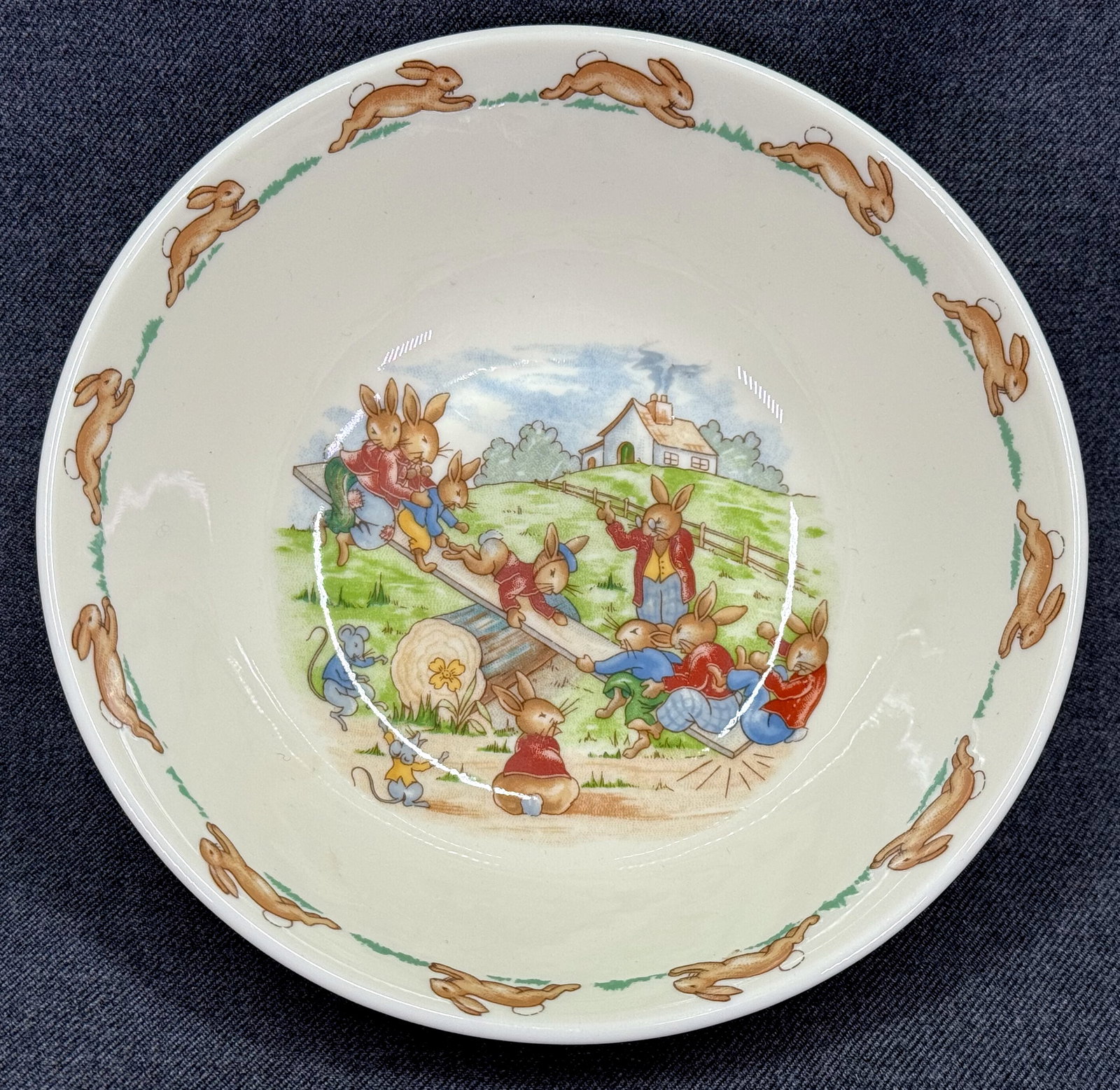Vintage Royal Doulton Bunnykins Seesaw Cereal Bowl: Vintage Royal Doulton Bunnykins Seesaw Cereal Bowl. Marked. For measures please refer to the pictures taken with a measuring tape. Weight: 9 Oz . IN HOUSE FLAT SHIPPING & HANDLING COST WITHIN ALL THE 