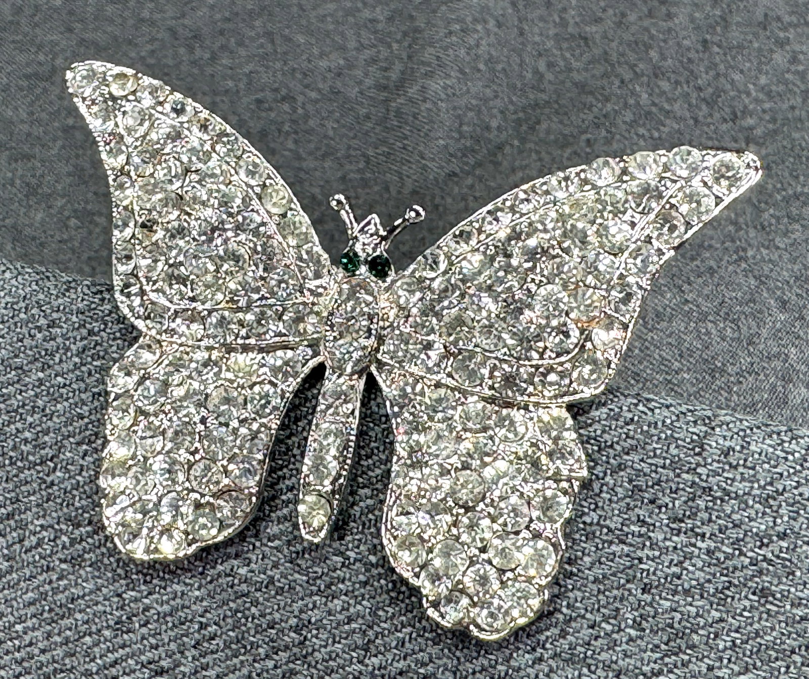 Vintage Marc Jacobs Butterfly Pin Brooch. Retired. Clear Pave & Green Crystal Eyes. *g: Vintage Marc Jacobs Butterfly Pin Brooch. Retired. Clear Pave & Green Crystal Eyes. Silver-toned. Signed. For measures please refer to the pictures taken with a measuring tape. Weight: Grams. IN HOUSE
