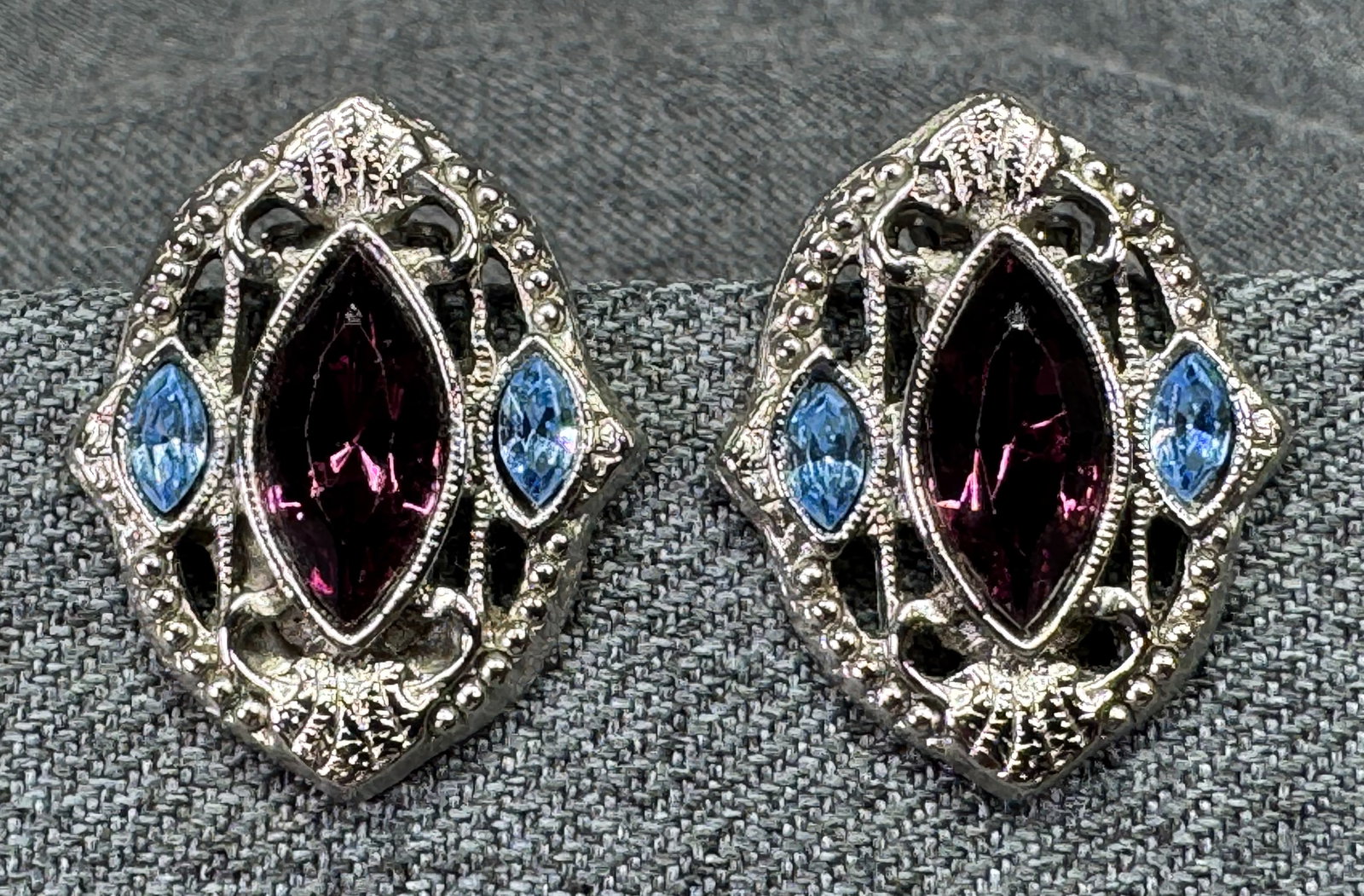 Vintage 1928 Brand Crystals Clip On Earrings. Silver-tone. *g: Vintage 1928 Brand Purple & Blue Marquise Crystals Silver-Tone Clip On Earrings. Unmarked. For measures please refer to the pictures taken with a measuring tape. Weight: 15 Grams. IN HOUSE FLAT SHIPPI