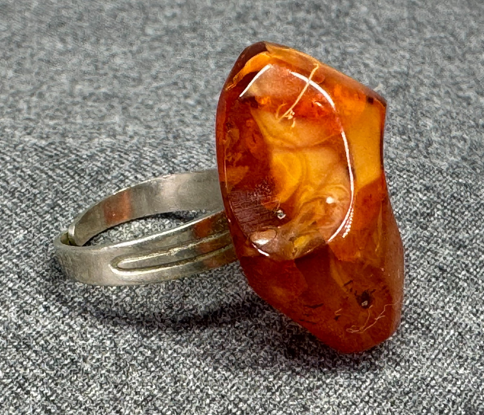 Vintage Large Freeform Baltic Amber Statement Ring. Adjustable Silver-Tone Band . *f: Vintage Large Freeform Baltic Amber Statement Ring. Adjustable Silver-Tone Band. Marked. For measures please refer to the pictures taken with a measuring tape. Weight: 7.85 Grams. IN HOUSE FLAT SHIPPI