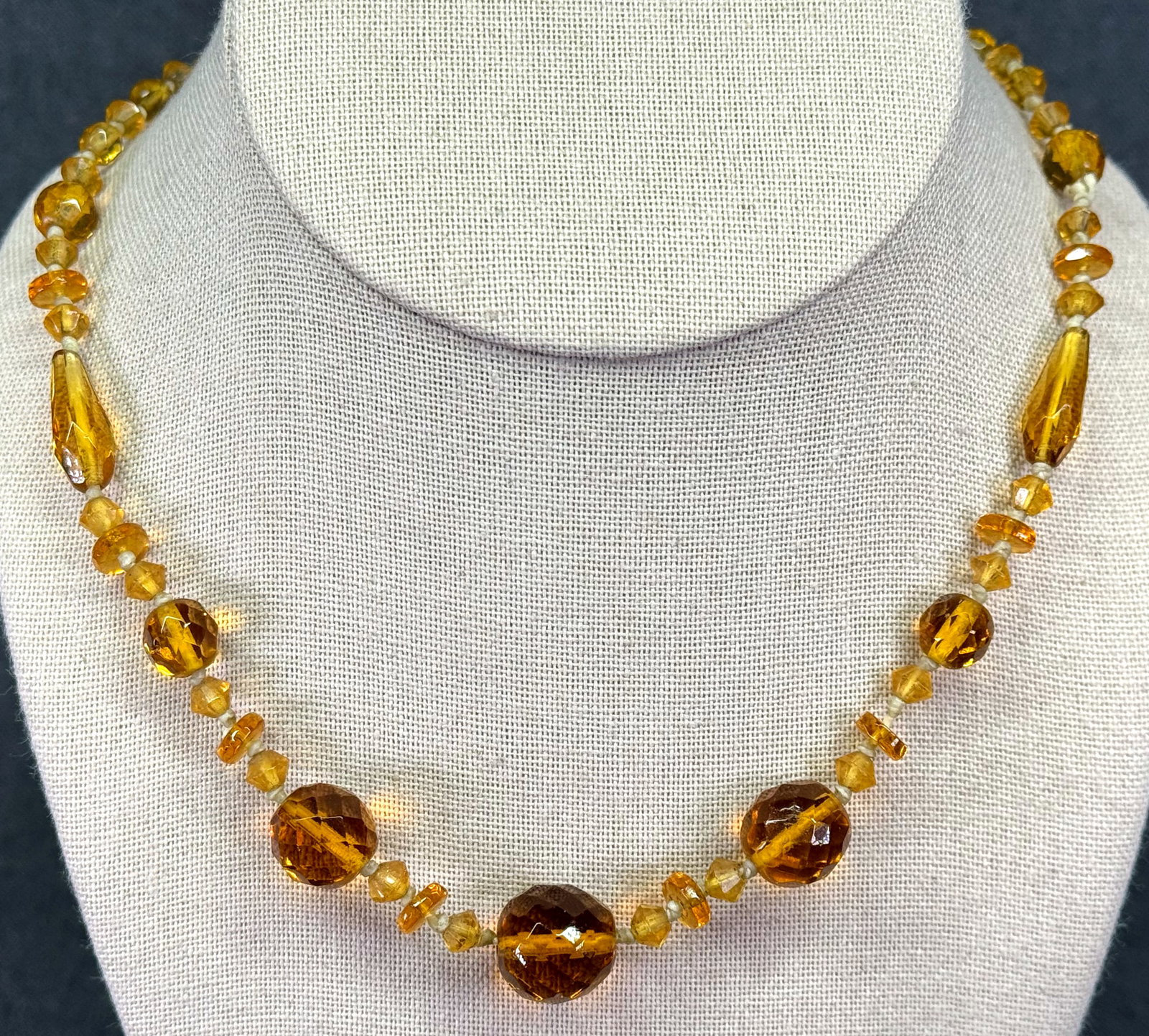 Antique art deco Czech amber color glass collar necklace. *d: Antique art deco Czech amber color glass collar necklace Unmarked. For measures please refer to the pictures taken with a measuring tape. Weight: 25 Grams. IN HOUSE FLAT SHIPPING & HANDLING COST WITHI