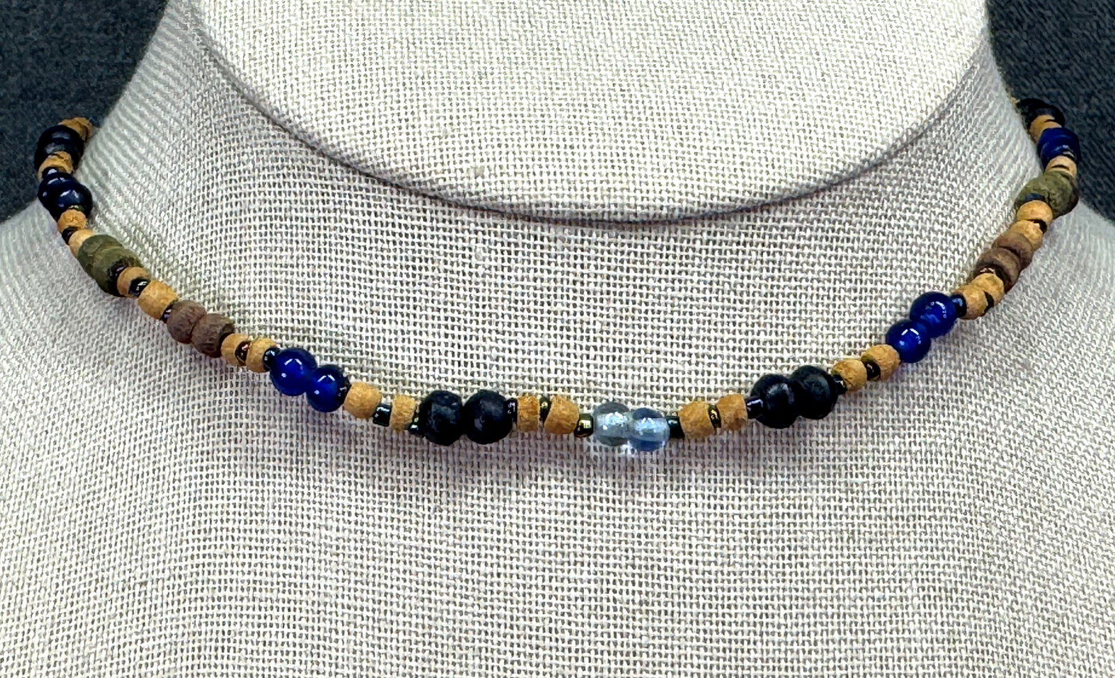 Vintage boho bluish glass & wooden choker necklace. #B: Vintage boho bluish glass & wooden choker necklace. Unmarked. # For measures please refer to the pictures taken with a measuring tape. Weight: 7 Grams. IN HOUSE FLAT SHIPPING & HANDLING COST WITHIN AL