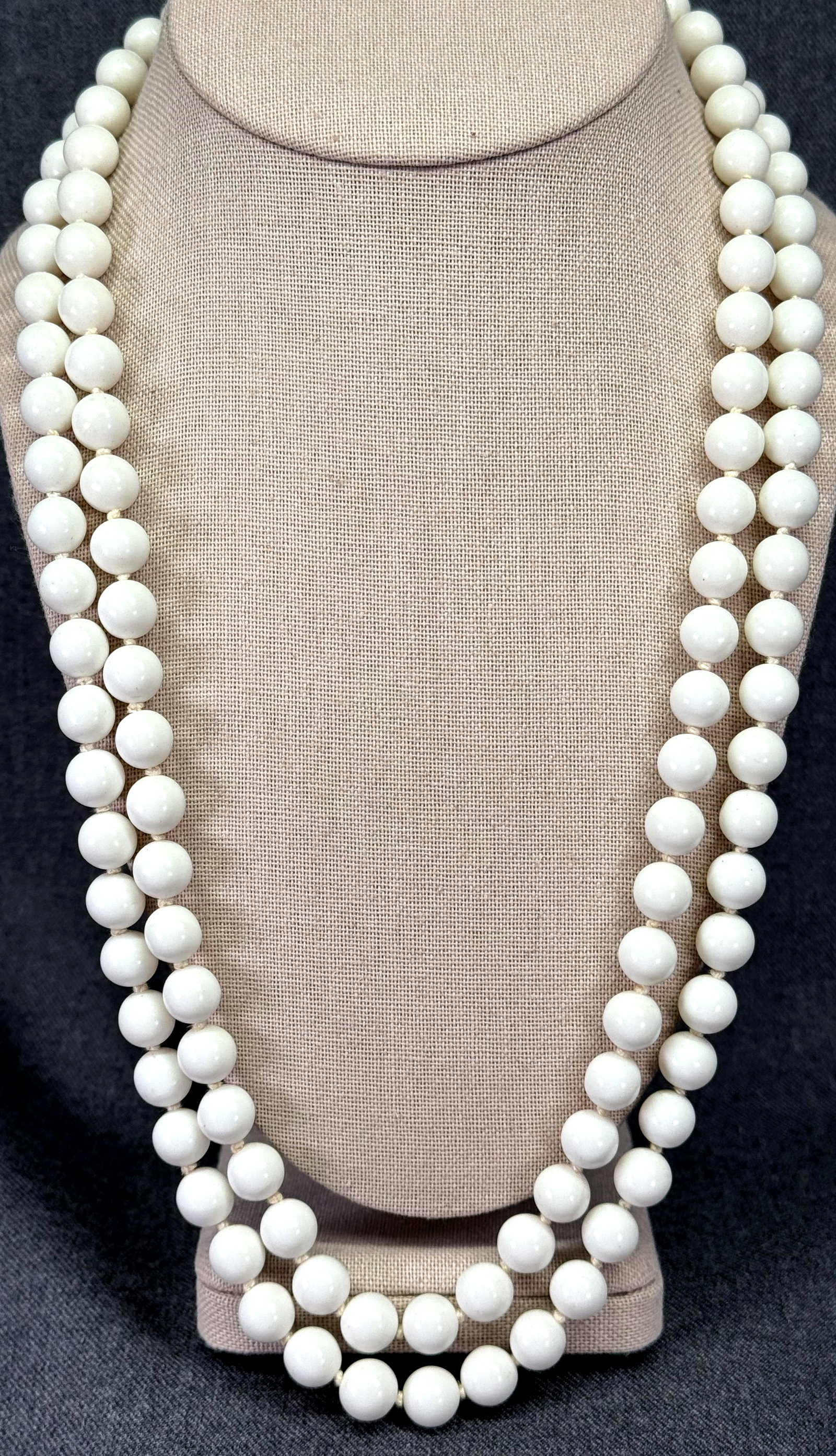 Vintage Japan white plastic hand knotted in between 2 strands necklace. #a: Vintage Japan white plastic hand knotted in between 2 strands necklace. Marked. For measures please refer to the pictures taken with a measuring tape. Weight: 75 Grams. IN HOUSE FLAT SHIPPING & HANDLI
