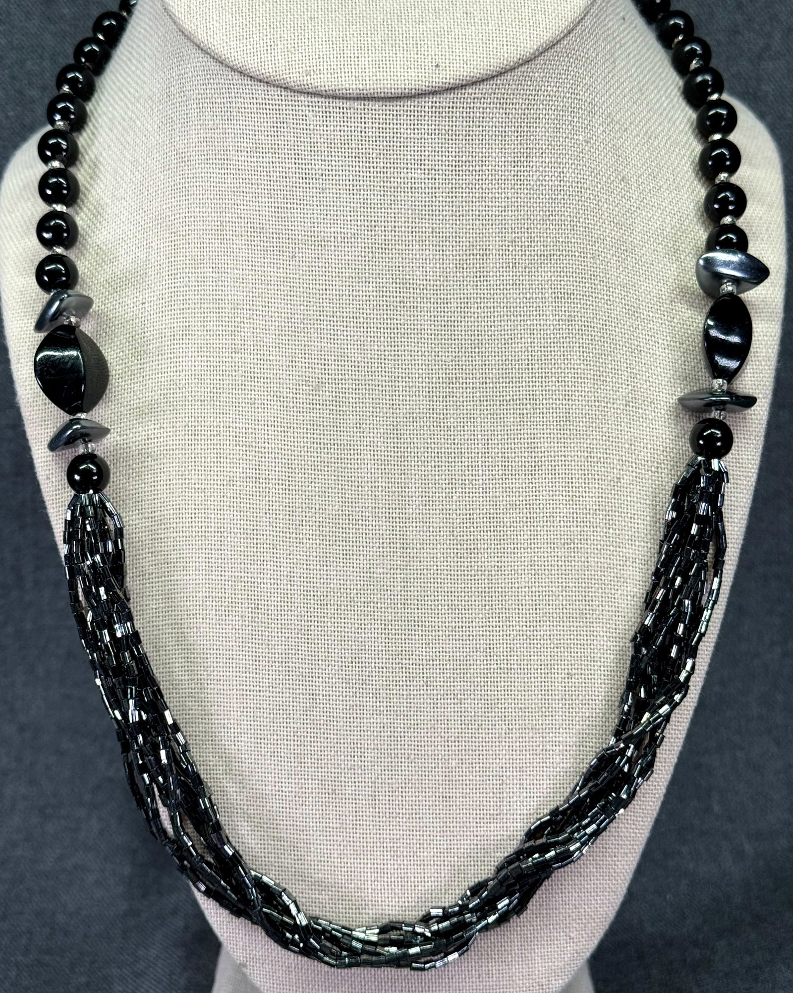 Vintage plastic & multi stand glass beaded necklace. #a: Vintage plastic & multi stand glass beaded necklace. Unmarked. For measures please refer to the pictures taken with a measuring tape. Weight: 23 Grams. IN HOUSE FLAT SHIPPING & HANDLING COST WITHIN AL
