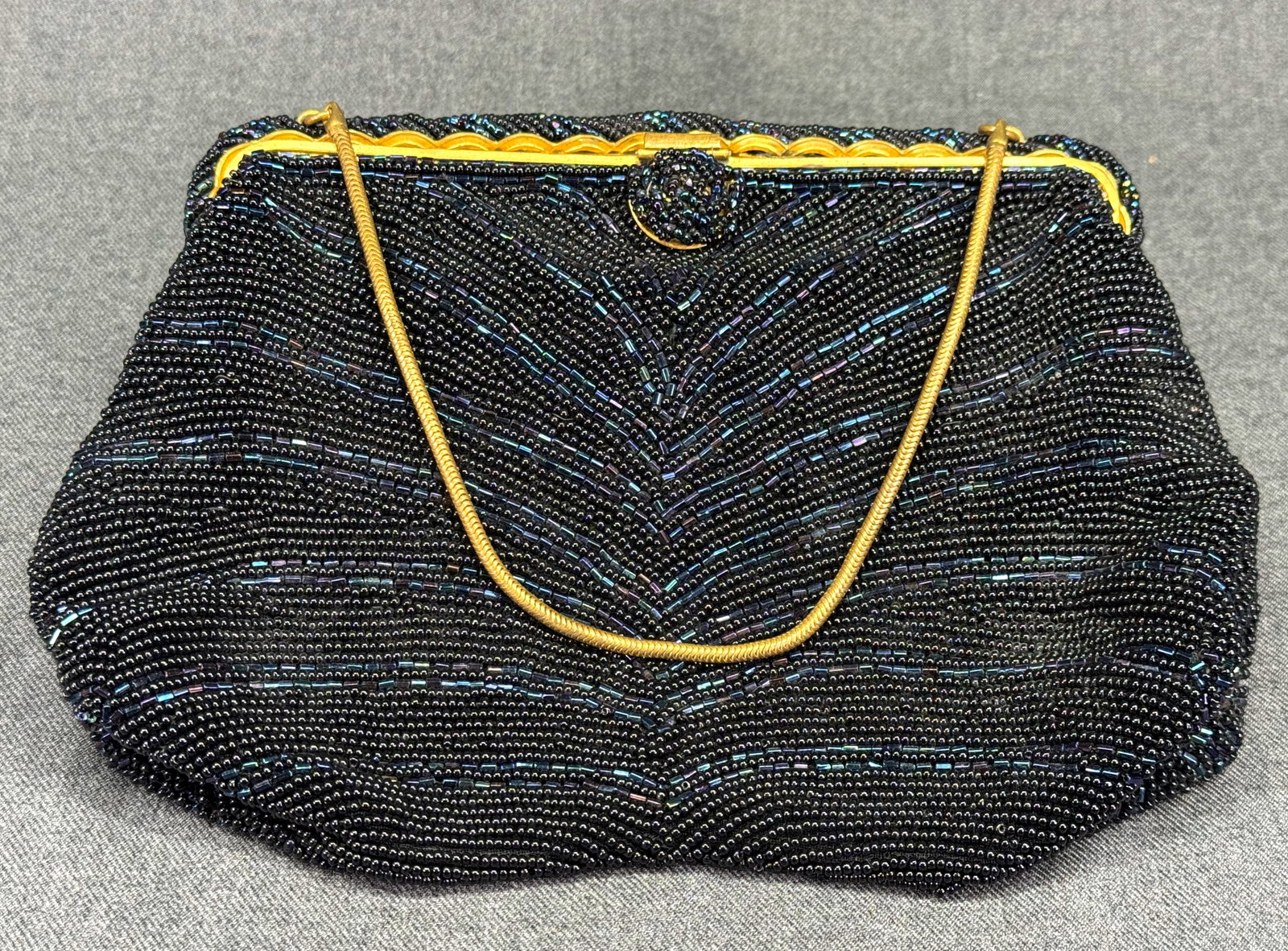 Vintage 1950s Saks Fifth Avenue French Beaded Evening Purse Bag. *K: Vintage 1950s Saks Fifth Avenue French Black & Blue Iridescent Beaded Evening Bag. Made in France. Lined in blue satin. Marked. Gold-tone chain strap. For measures please refer to the pictures taken w