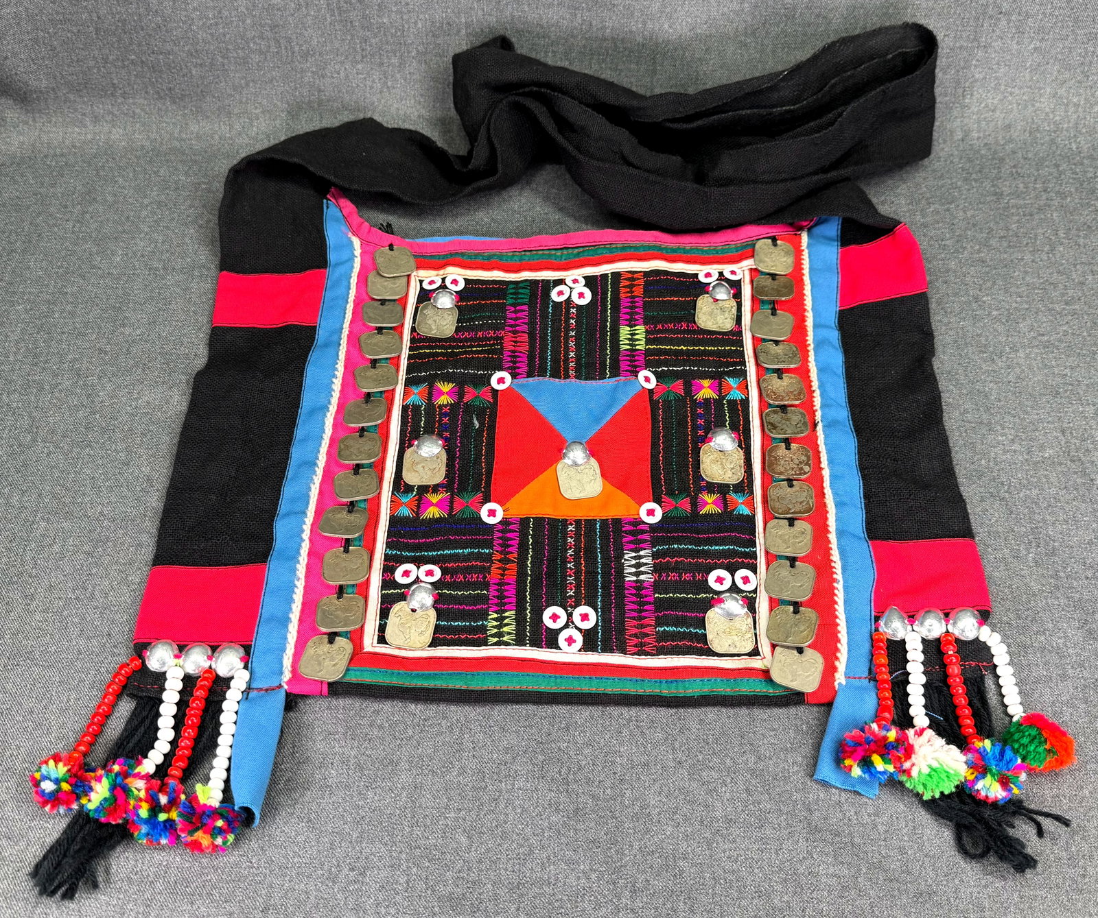 Vintage Akha Hill Tribe Embroidered Bag with 1950s Burma coins. *K: Vintage Akha Hill Tribe Embroidered Bag with 1950s Burma coins. For measures please refer to the pictures taken with a measuring tape. Weight: Grams. IN HOUSE FLAT SHIPPING & HANDLING COST WITHIN ALL 