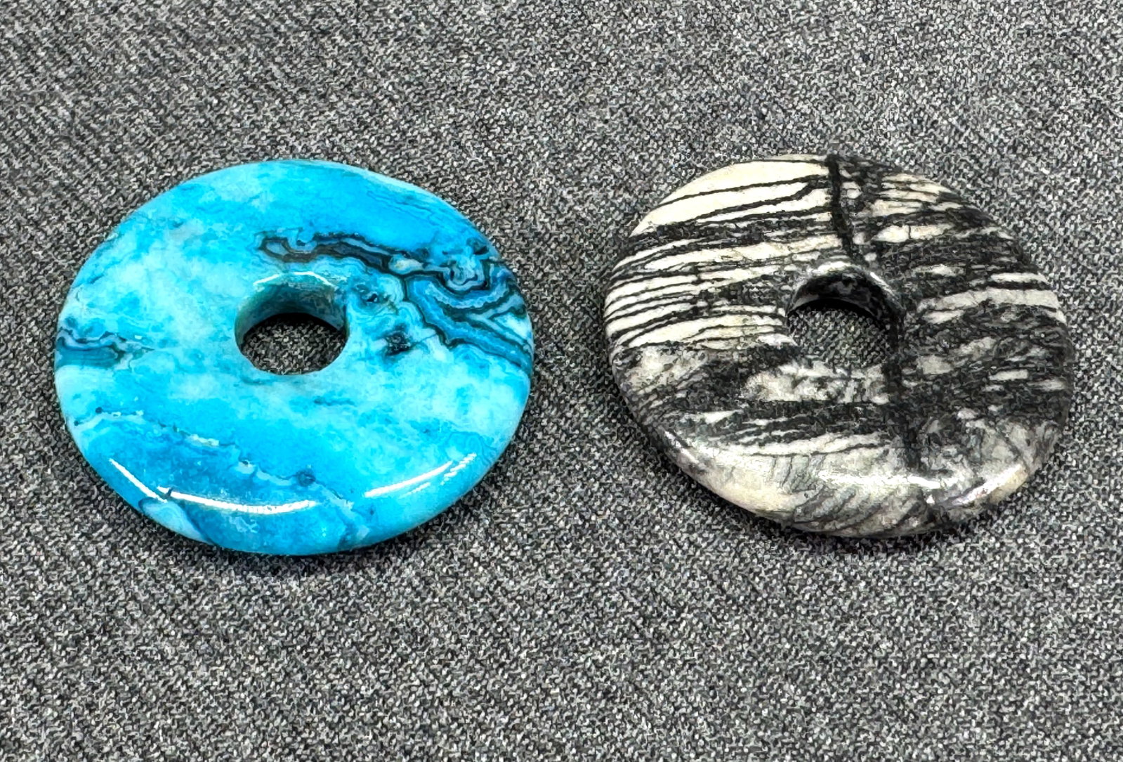 Zebra Jasper & Dyed Blue Howlite Stones Donut Pendants. *K: Zebra Jasper & Dyed Blue Howlite Stones Donut Pendants. Unmarked. For measures please refer to the pictures taken with a measuring tape. Weight: 22 Grams. IN HOUSE FLAT SHIPPING & HANDLING COST WITHIN