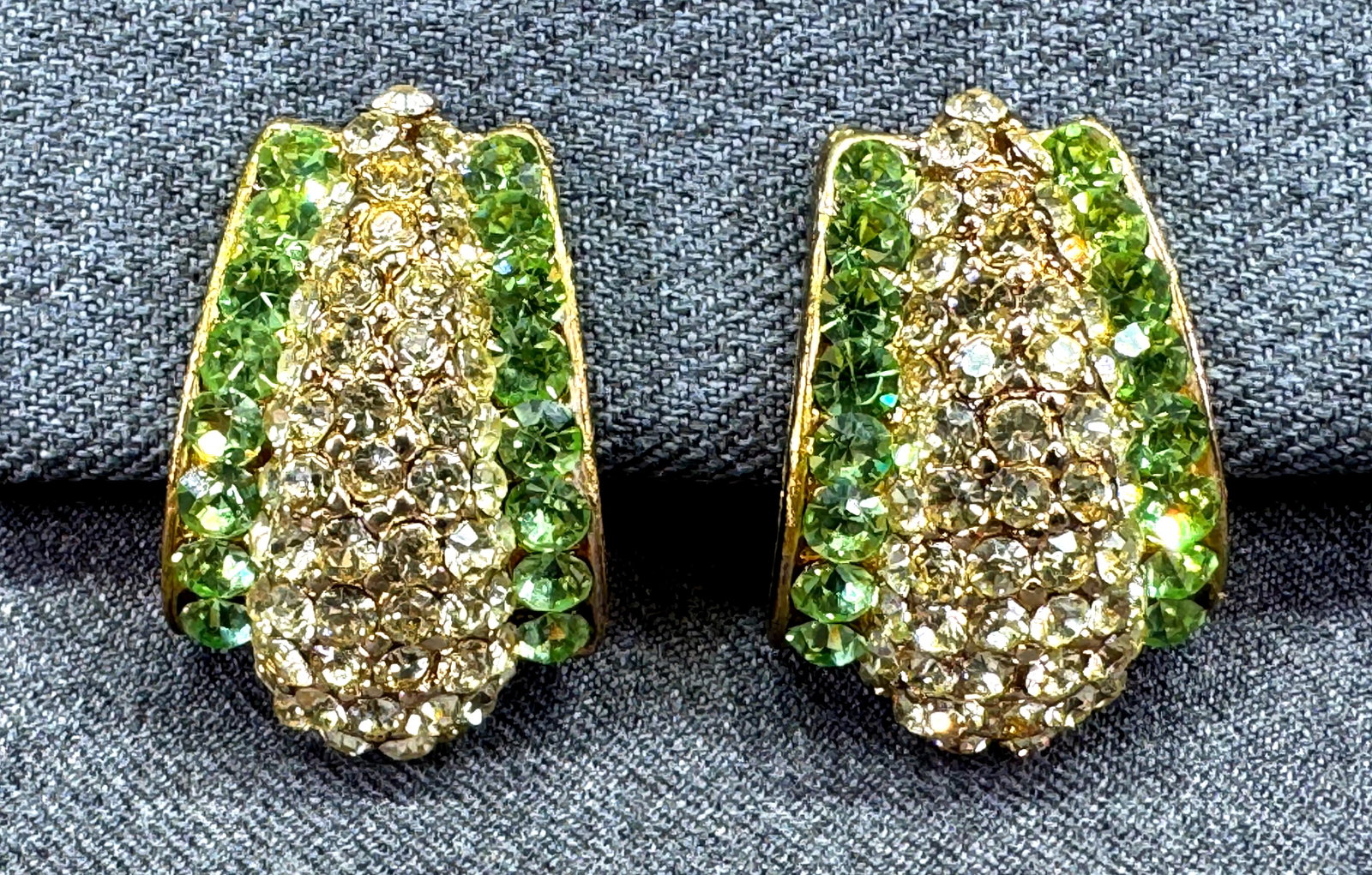 Vintage Peridot-Green & Clear Crystals Clip On Earrings. Gold-tone. 1r*h: Vintage Peridot-Green & Clear Crystals Clip On Earrings. Gold-tone. Unmarked. For measures please refer to the pictures taken with a measuring tape. Weight: 35 Grams. IN HOUSE FLAT SHIPPING & HANDLING