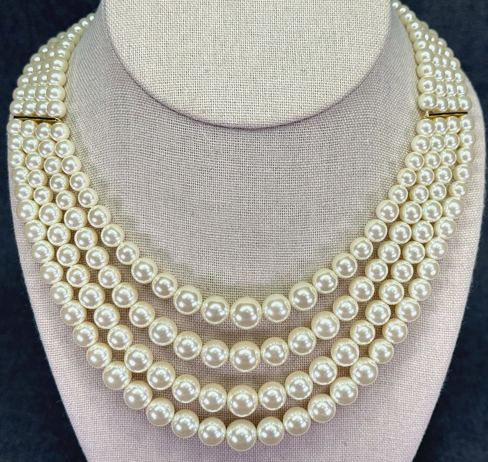 Vintage four-strand layered pearl necklace. Gold-toned metal. *f: Vintage four-strand layered pearl necklace. Gold-toned metal. Unmarked. For measures please refer to the pictures taken with a measuring tape. Weight: 70 Grams. IN HOUSE FLAT SHIPPING & HANDLING COST 