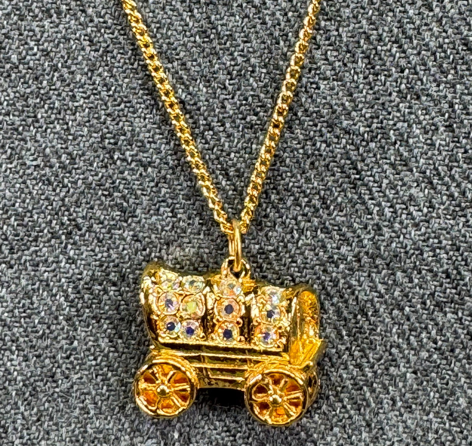 Vintage ORA Covered Wagon Charm Necklace. AB crystals, gold-toned. Unused in box. *f: Vintage ORA Covered Wagon Charm Necklace. AB crystals, gold-toned. Marked. Unused in box. For measures please refer to the pictures taken with a measuring tape. Weight: 3 Grams. IN HOUSE FLAT SHIPPING
