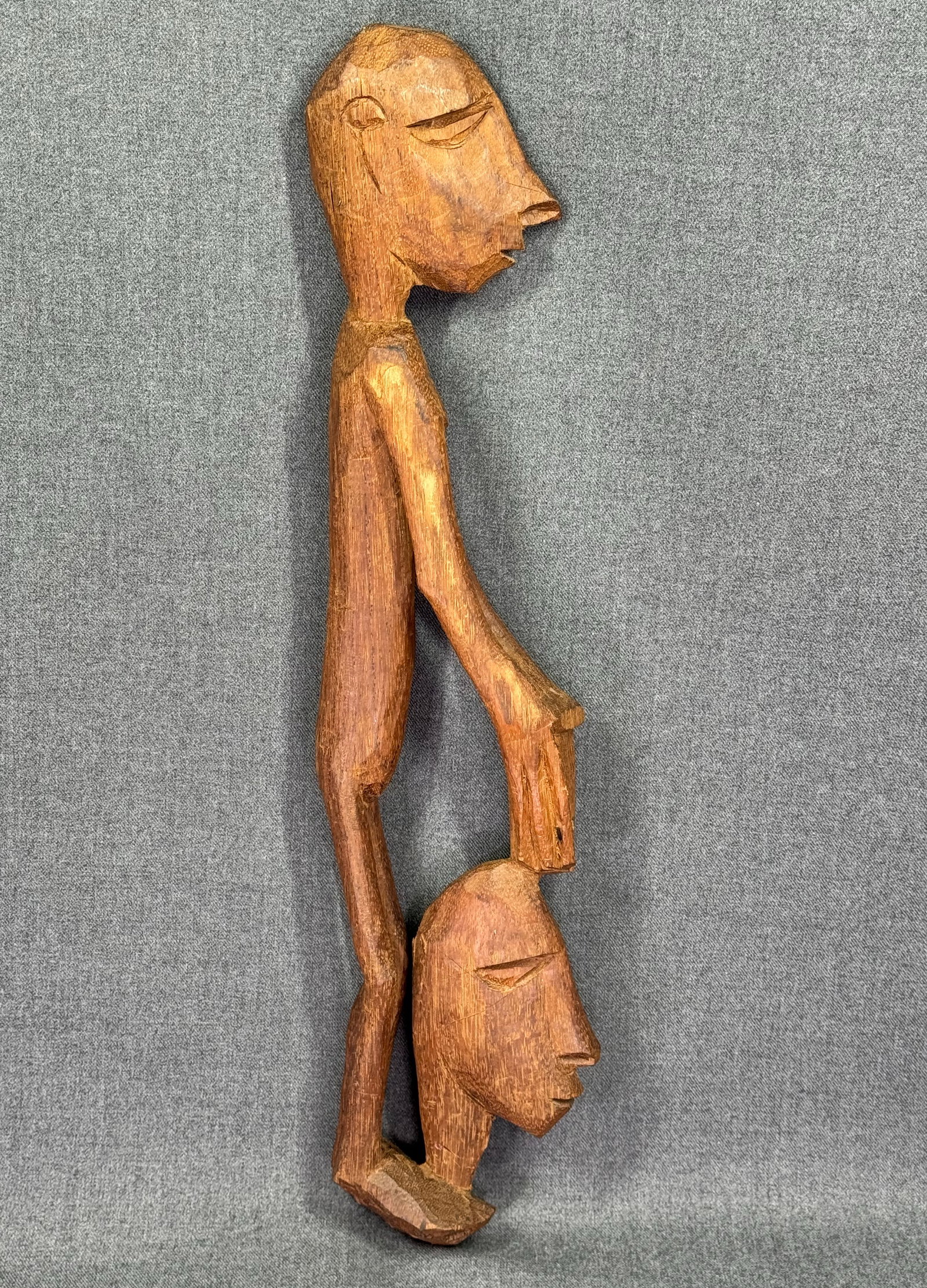 Papua New Guinea Asmat Headhunter with Head. Carved wood. *L (1 of 10)
